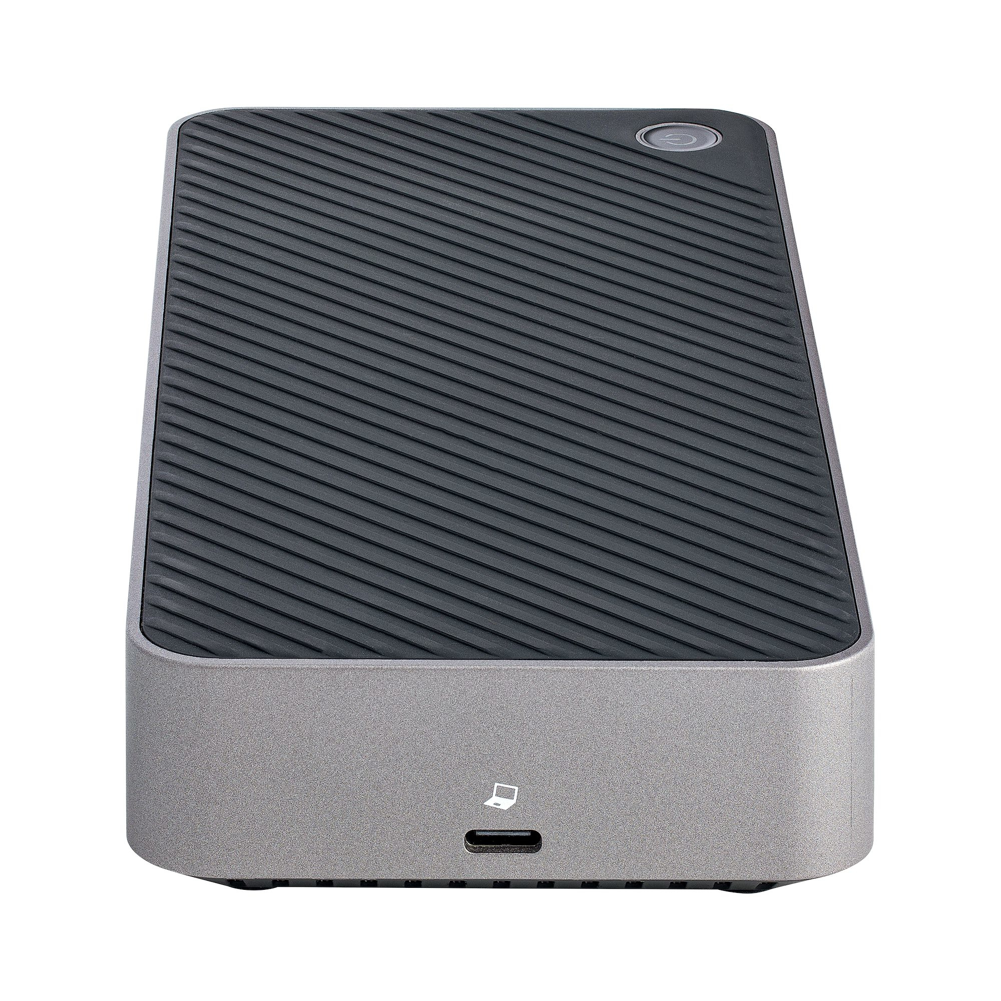 Un disco rigido esterno grigio, rettangolare, con parte superiore nera. Ha una porta USB.