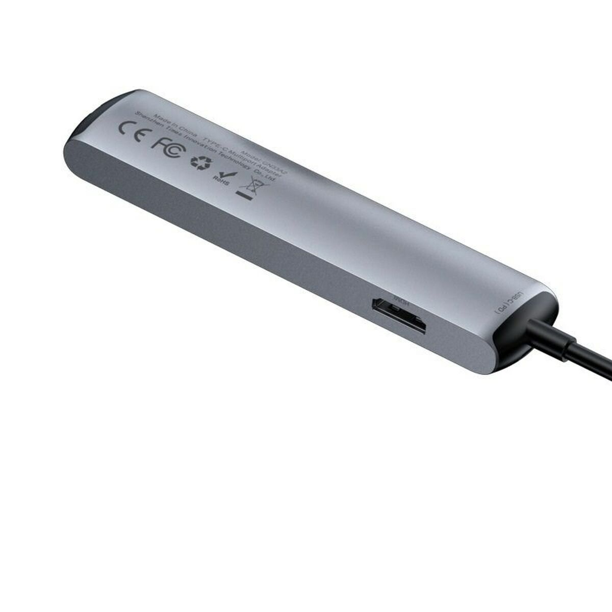 Hub argento con più porte. Porta HDMI visibile. L'hub è scuro. Lo sfondo è bianco.