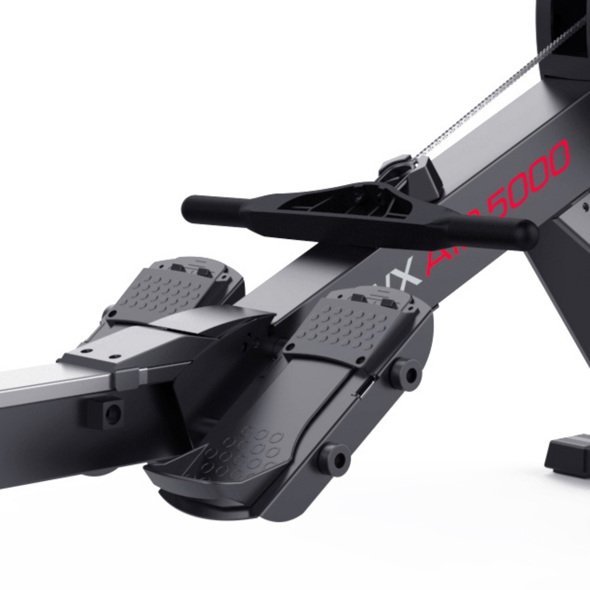 Rowing machine, close up of the footrests, handle, and part of the frame. Black and red.