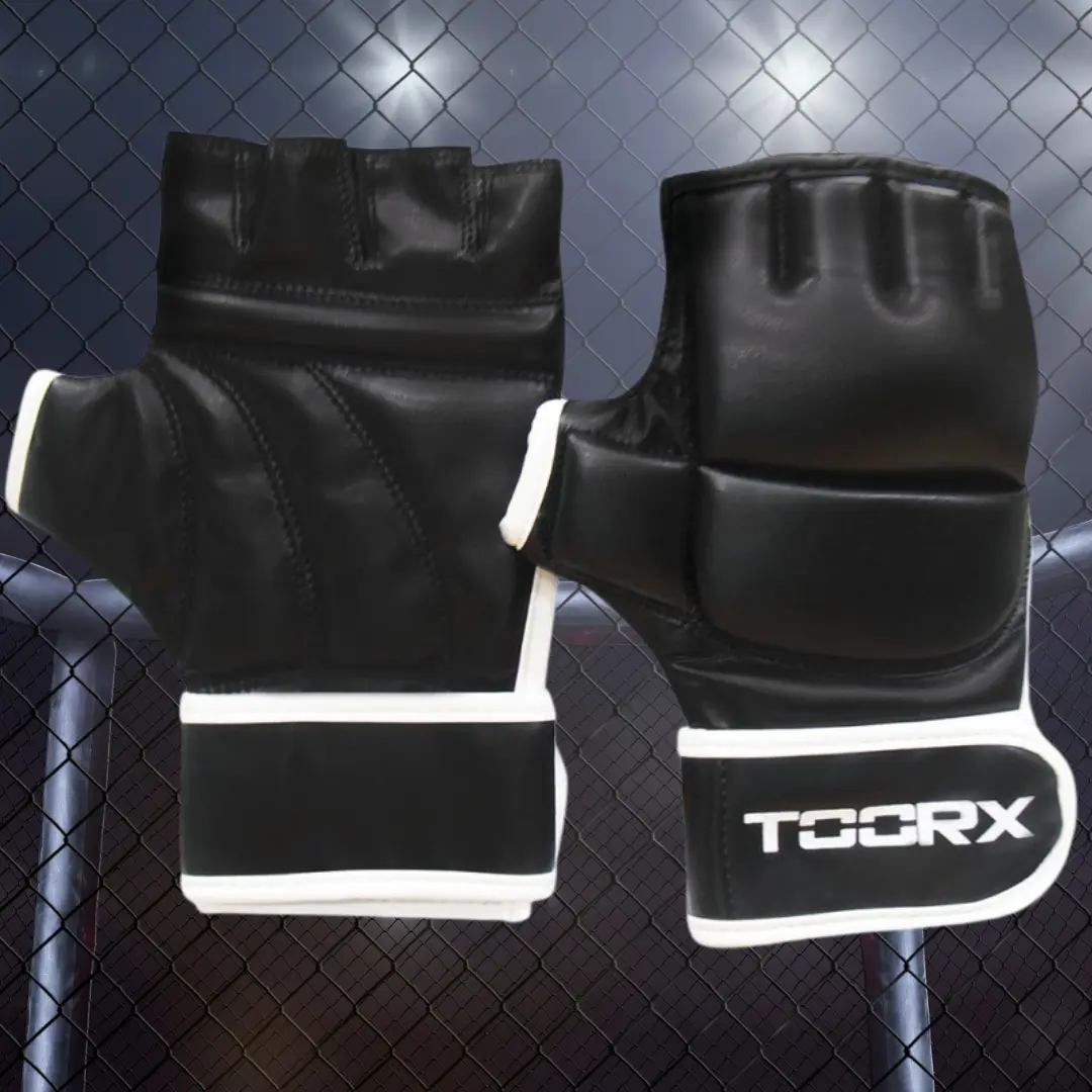 Black and white MMA gloves with white accents, on a cage background.