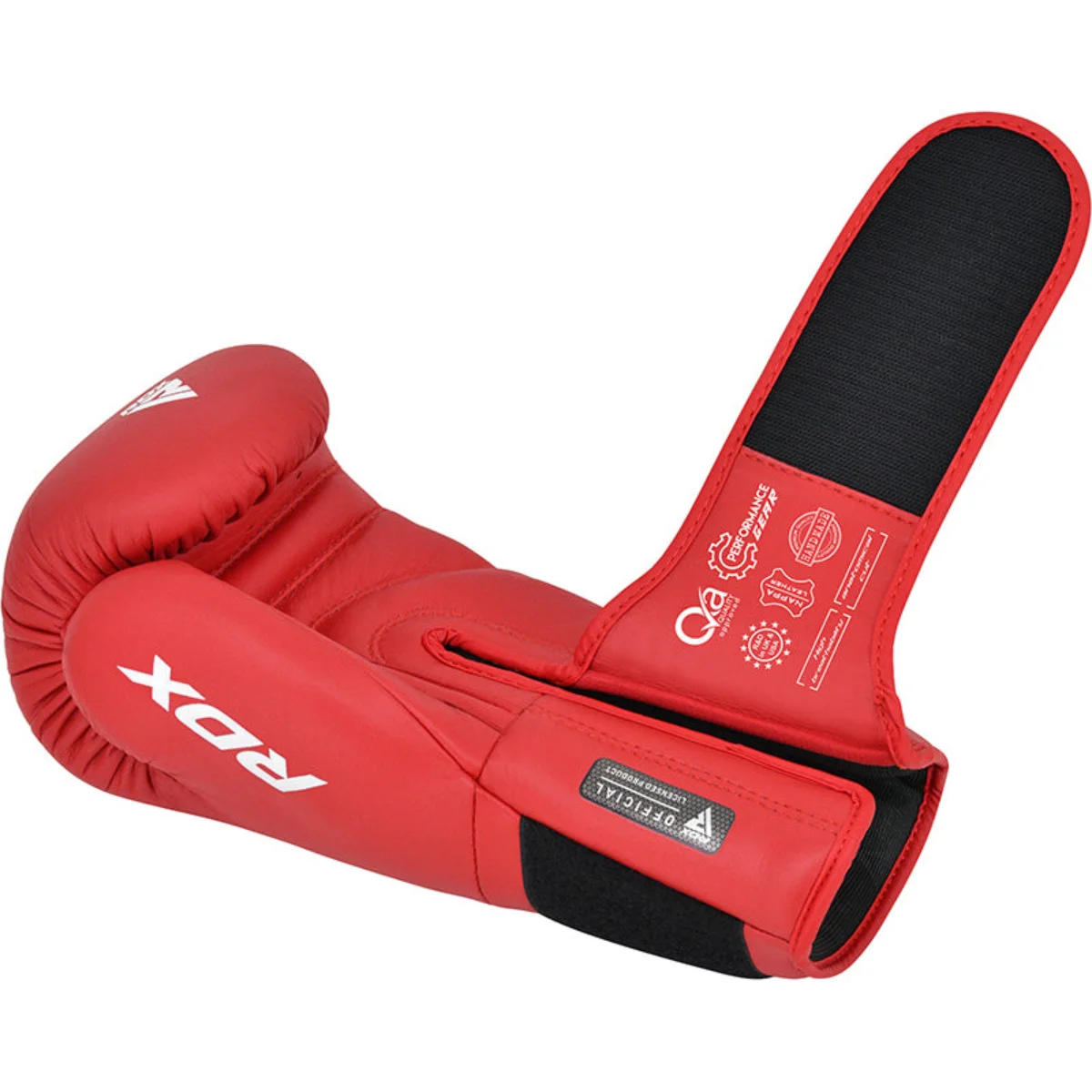 Red boxing glove, RDX logo visible, with a white label on the wrist strap.