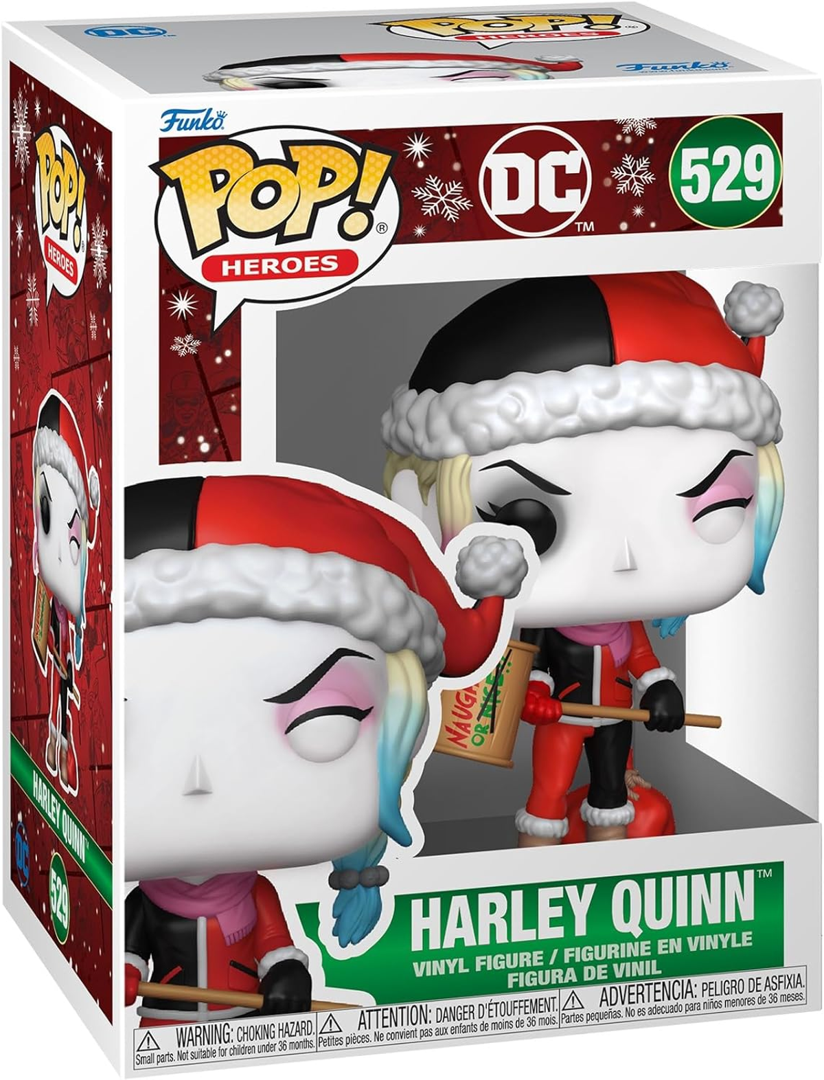 Figura Funko Pop de Harley Quinn en una caja navideña. Lleva gorro de Papá Noel y sostiene un letrero.