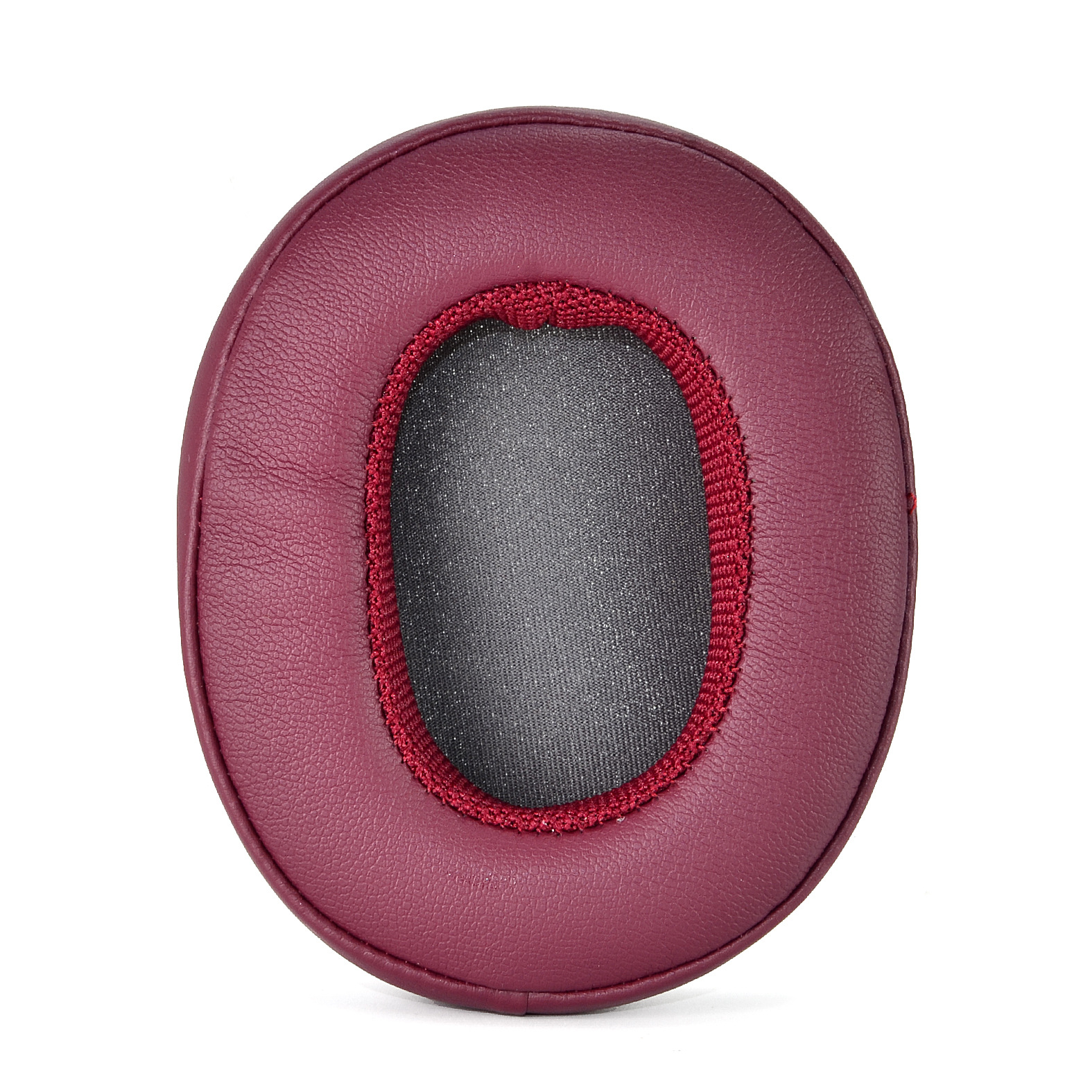 Bordowo-czerwona poduszka do słuchawek, okrągły kształt, czerwona obwódka, ciemnoszary materiał wewnętrzny.