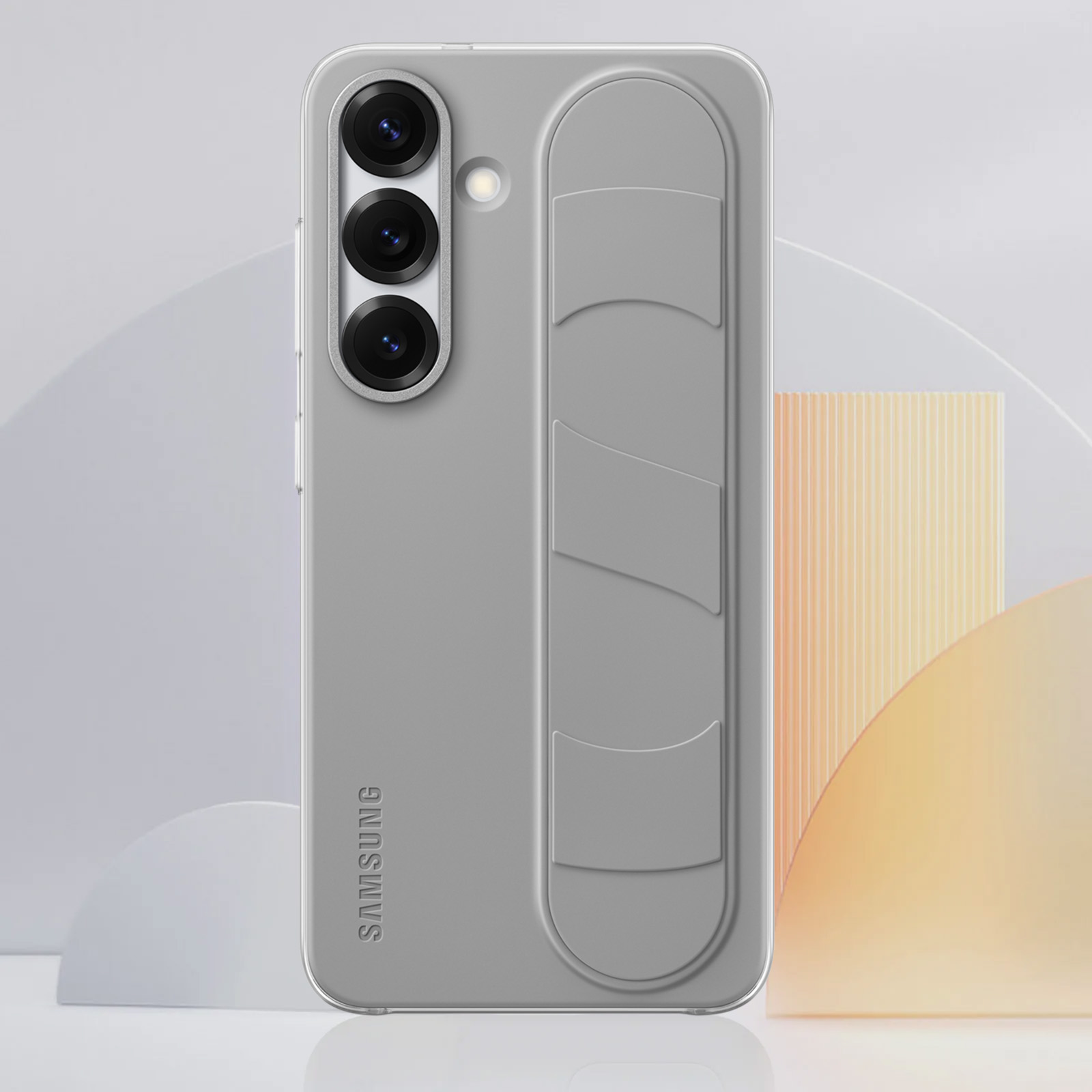 Szare etui na telefon z uchwytem z tyłu. Telefon ma trzy aparaty. Widoczne logo Samsung.