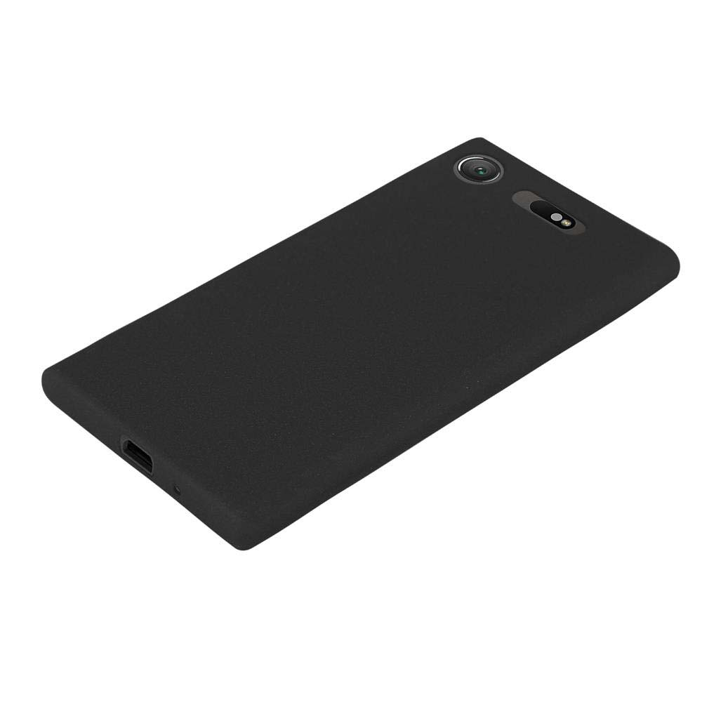 Uno smartphone nero, appoggiato su una superficie bianca, con fotocamera e flash sul retro.