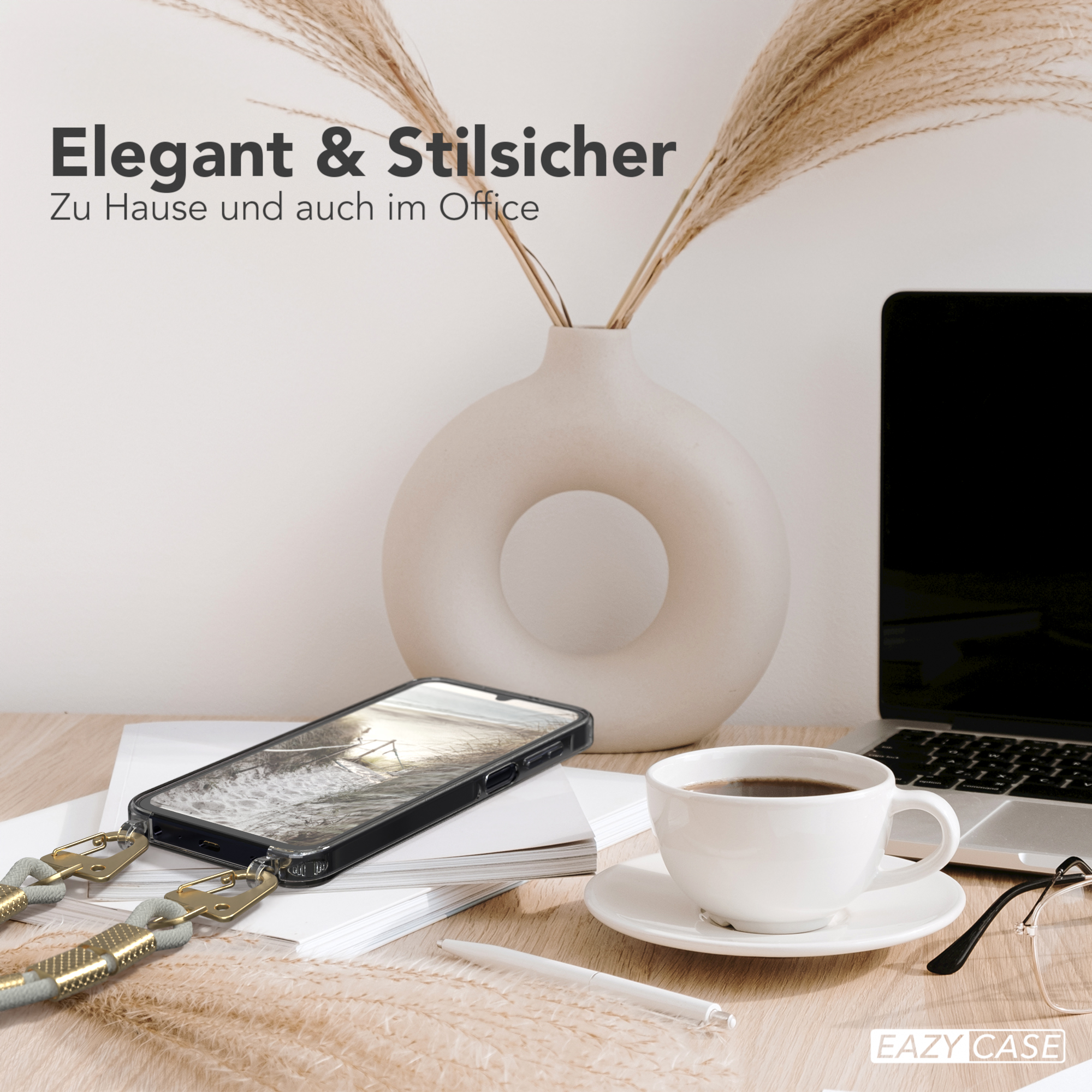 Ein Telefon mit Hülle, eine Tasse, ein Stift, eine Brille und eine Vase mit Pflanzen.