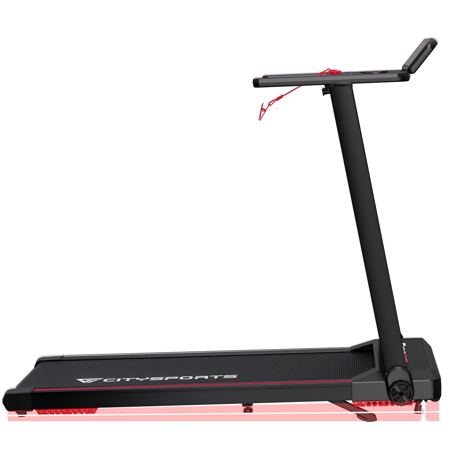 Czarna bieżnia z czerwonymi akcentami, na białym tle.