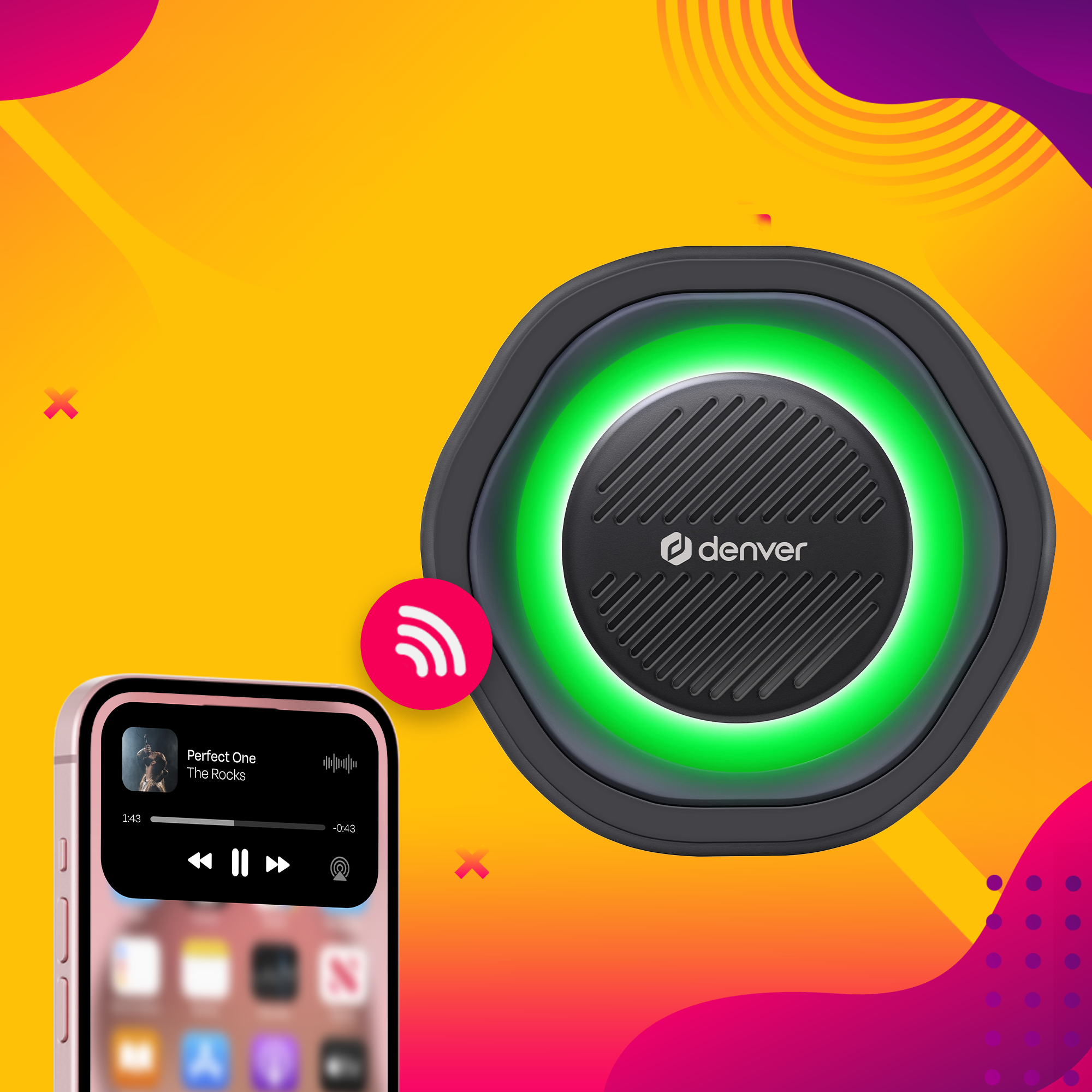 Czarny głośnik z zielonym światłem. Obok różowy telefon z aplikacją muzyczną.