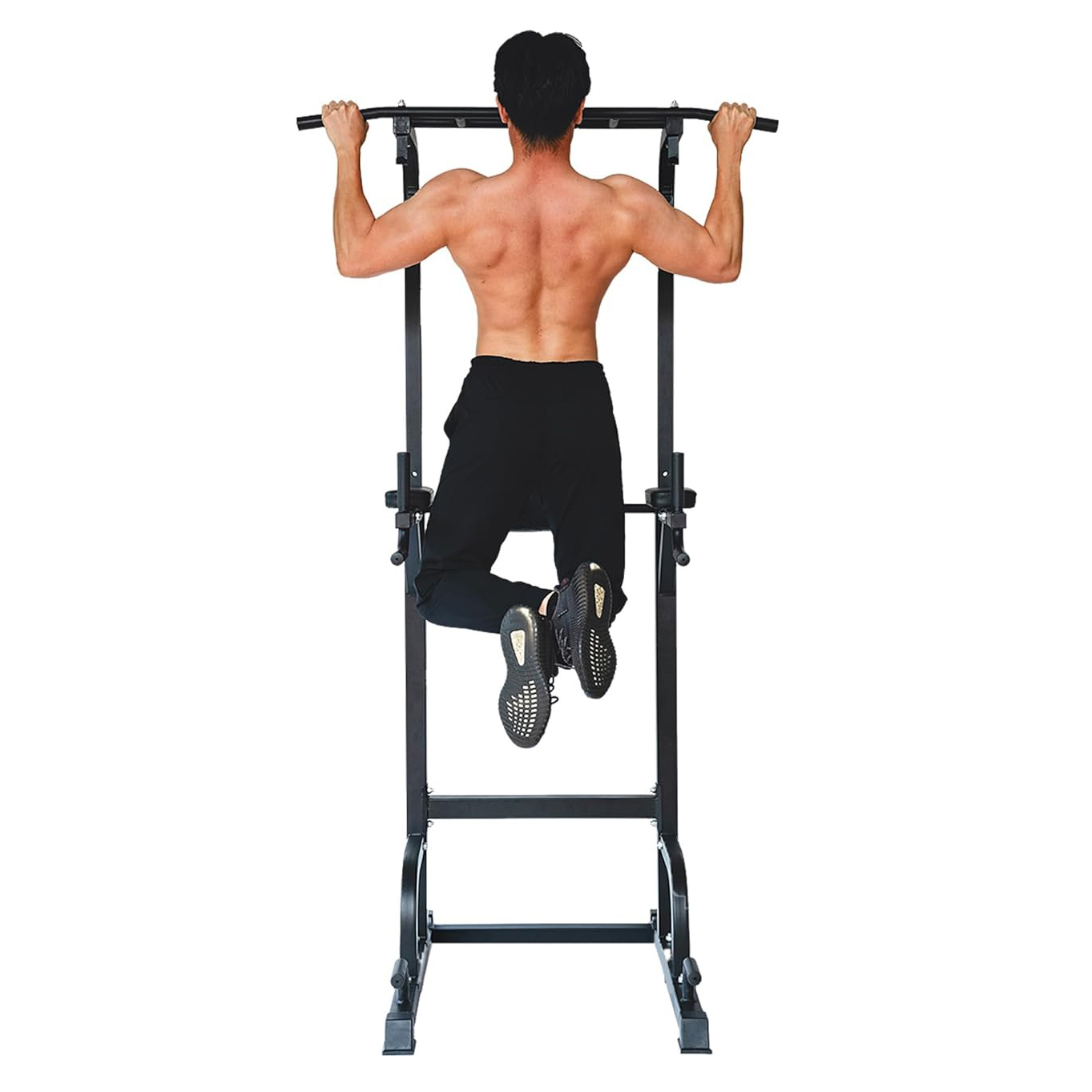 Man doing pull-ups on a pull-up bar, shirtless, showing back muscles.