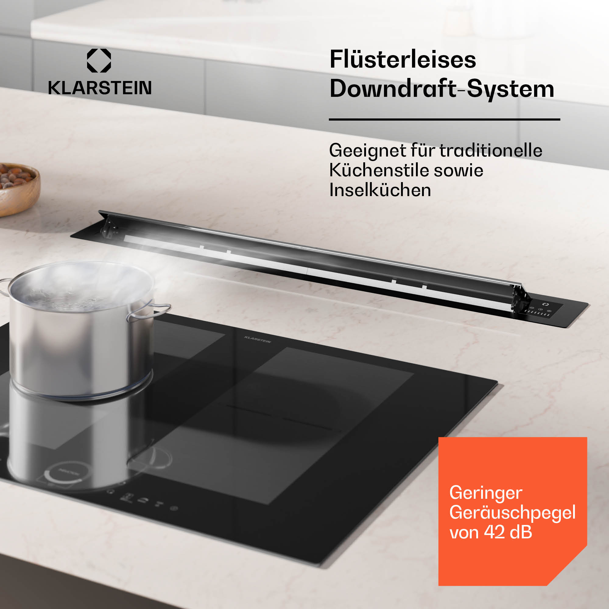 Cucina con fornello nero e pentola d'argento. Testo: Sistema downdraft, adatto per cucine tradizionali.