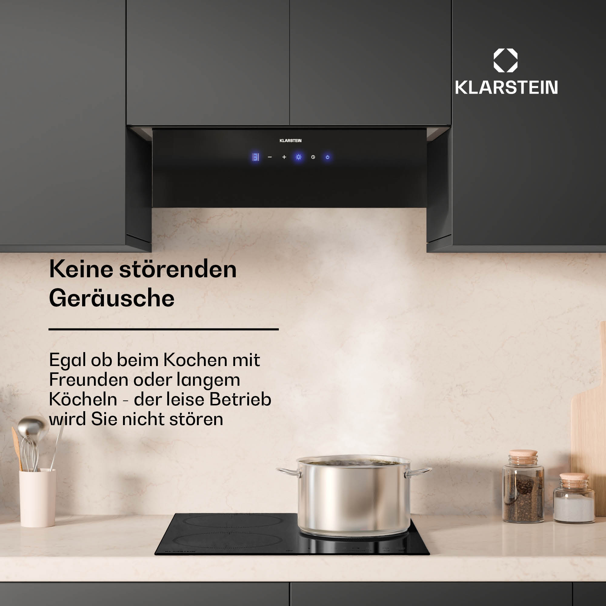 Eine schwarze Dunstabzugshaube über einem Kochfeld mit Topf. Text: 'Keine störenden Geräusche'.