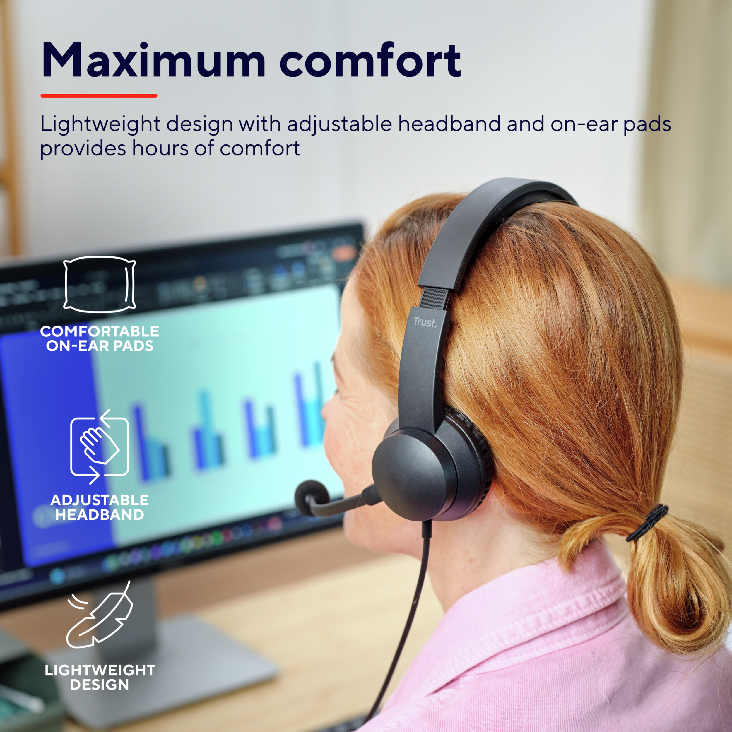 Woman wearing a black headset while working on a computer. Features on-ear pads and headband.