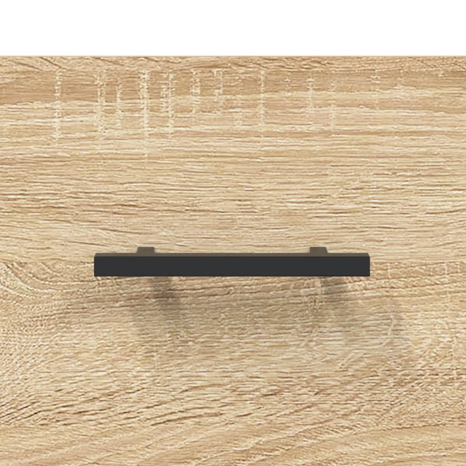 Holzschublade mit schwarzem Griff. Die Holzmaserung ist sichtbar.