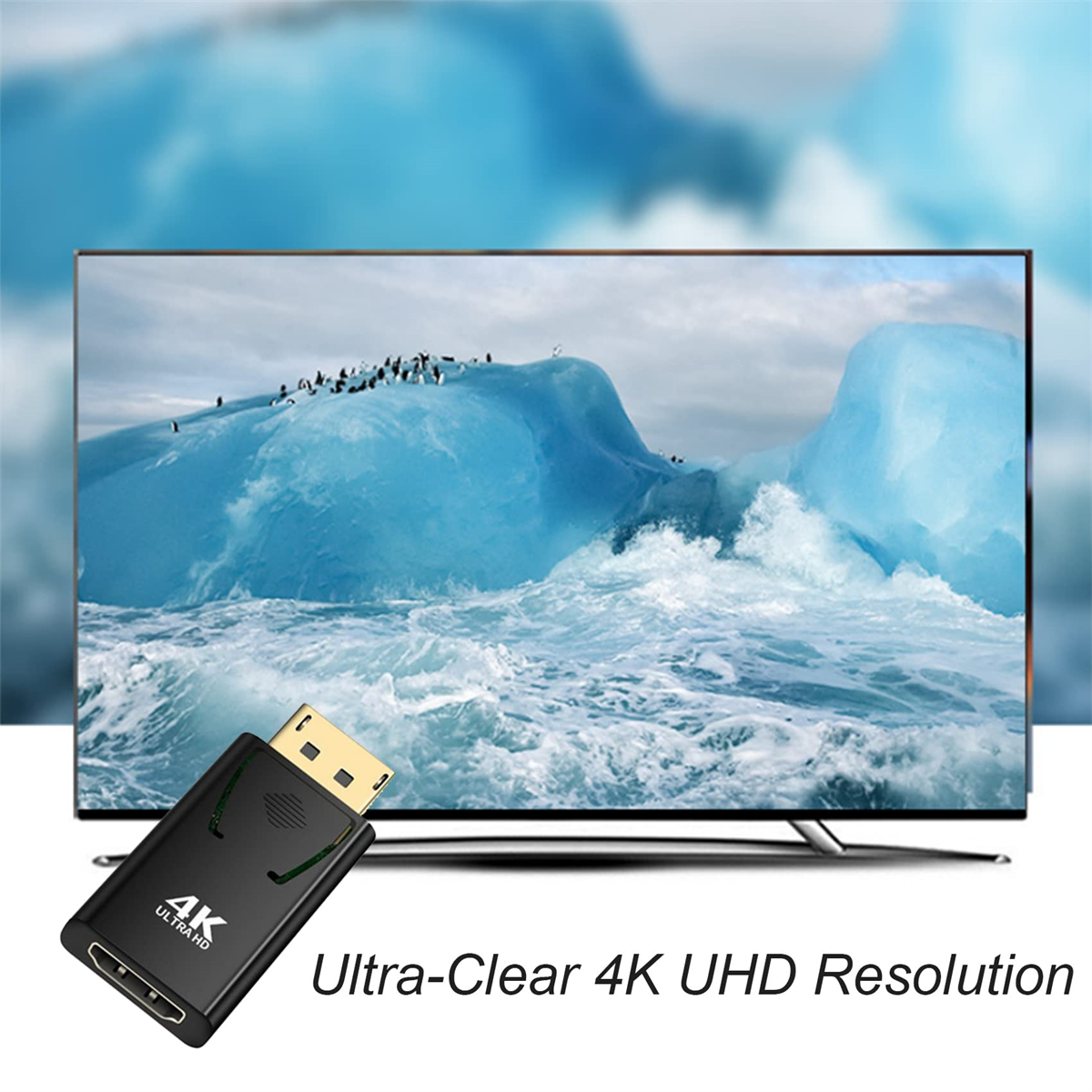 TV-Bildschirm mit Gletscherlandschaft und Pinguinen. Schwarzer HDMI-Adapter im Vordergrund.