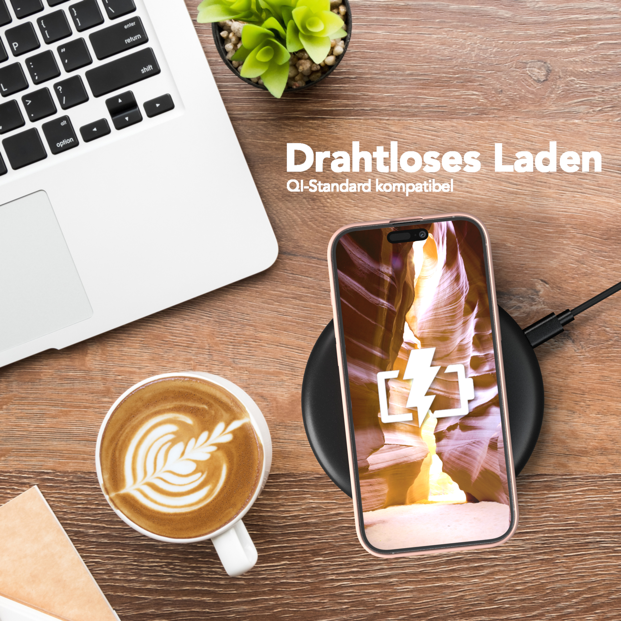 Ein Telefon, das drahtlos auf einem schwarzen Pad geladen wird. Laptop, Kaffee und Text 'Drahtloses Laden' sind sichtbar.