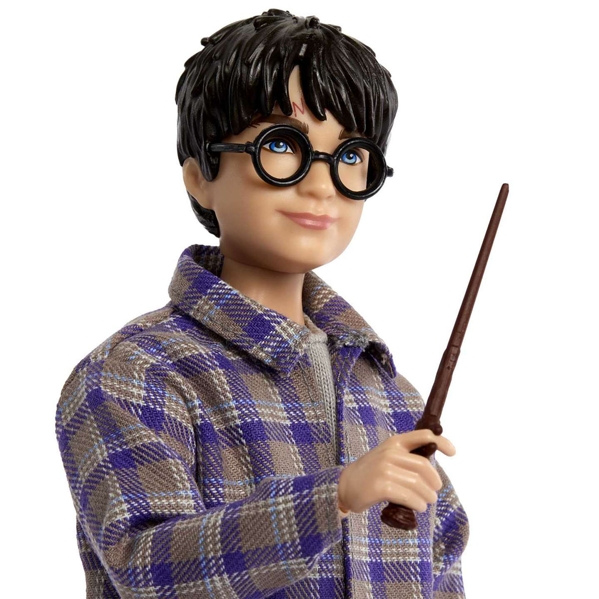 Bambola di Harry Potter con occhiali e bacchetta, indossa una camicia a quadri.