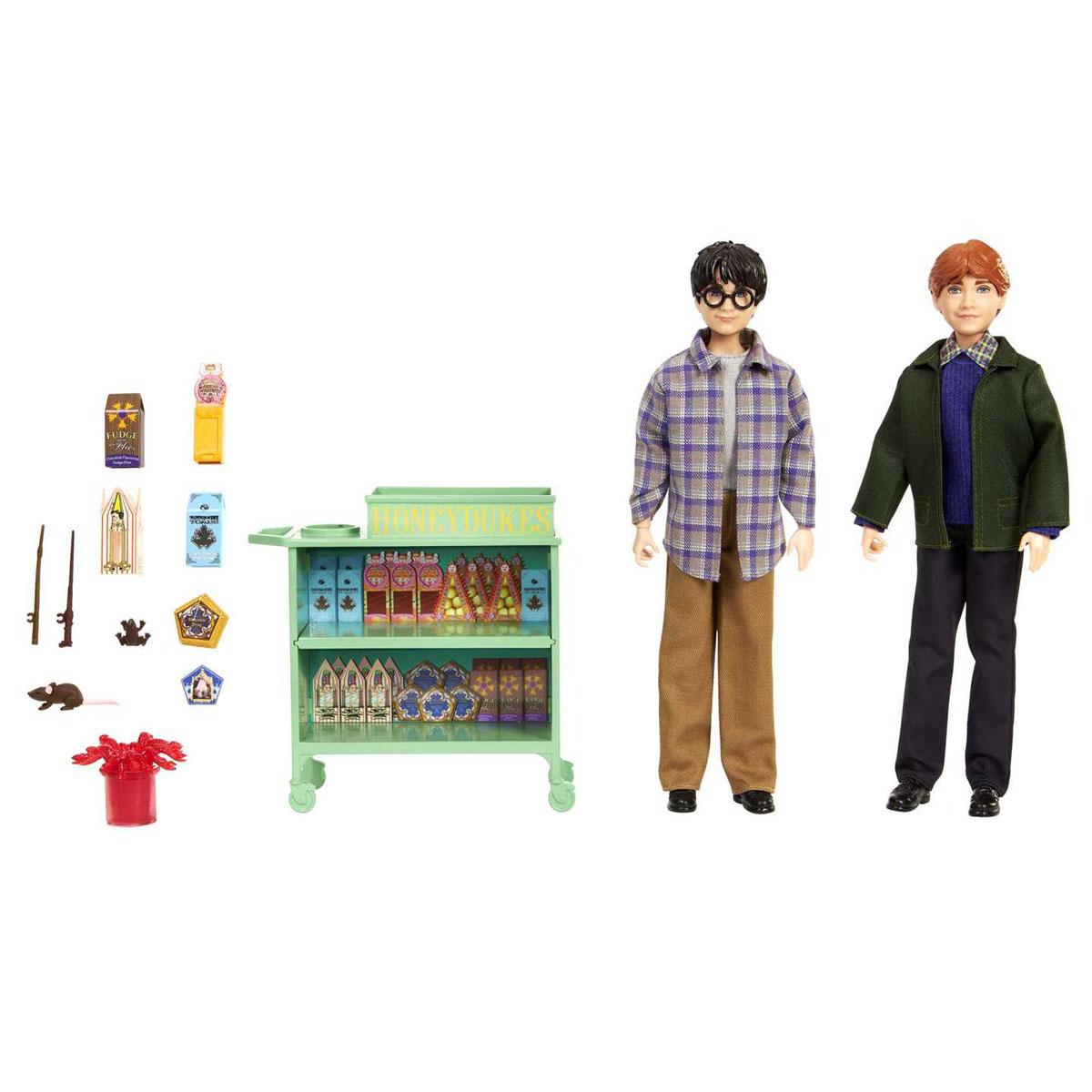 Bambole di Harry Potter e Ron Weasley accanto a un carrello di Honeydukes con caramelle e accessori.