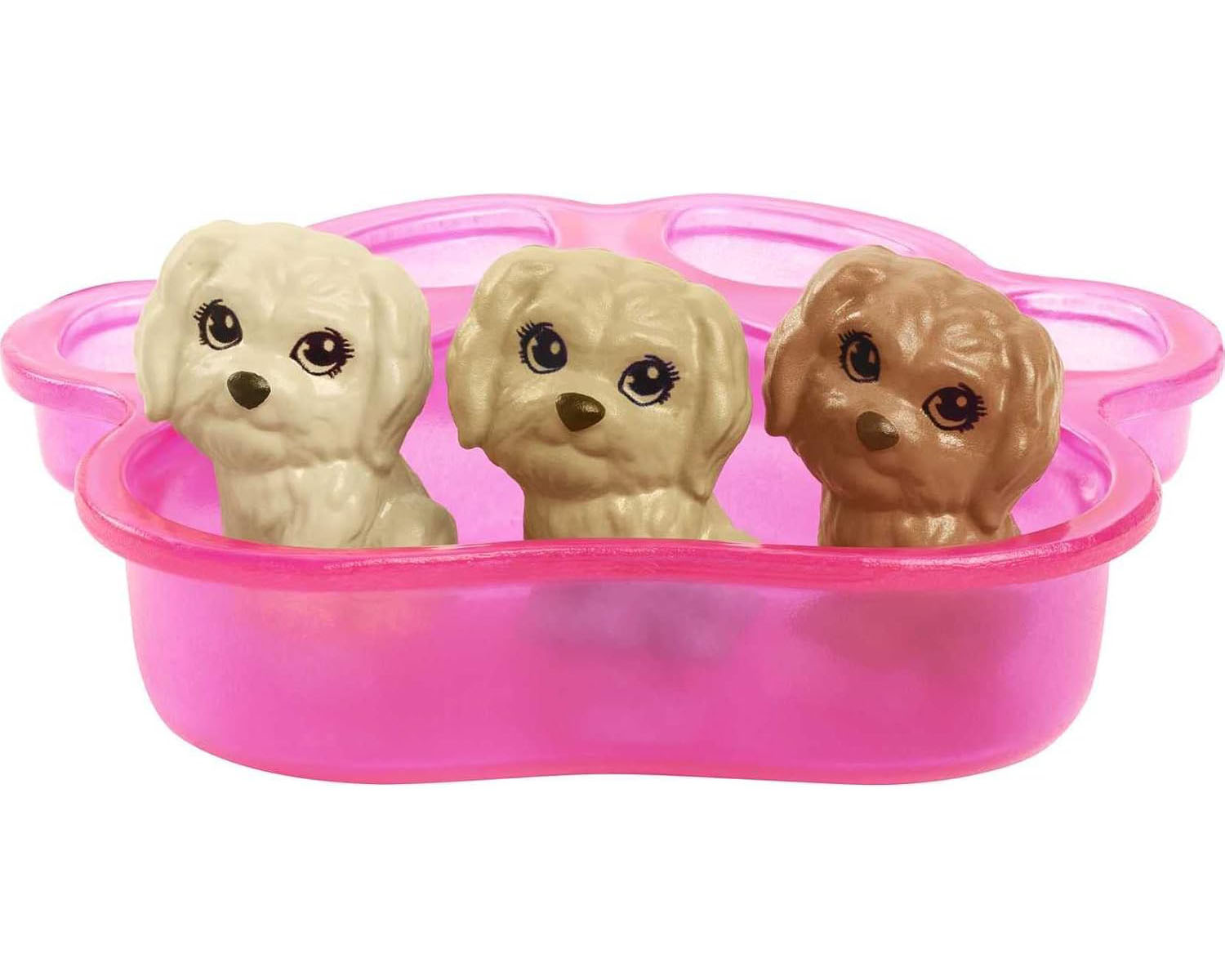 Trzy zabawki szczenięta w różowym pojemniku w kształcie łapy. Beżowe i brązowe psy.