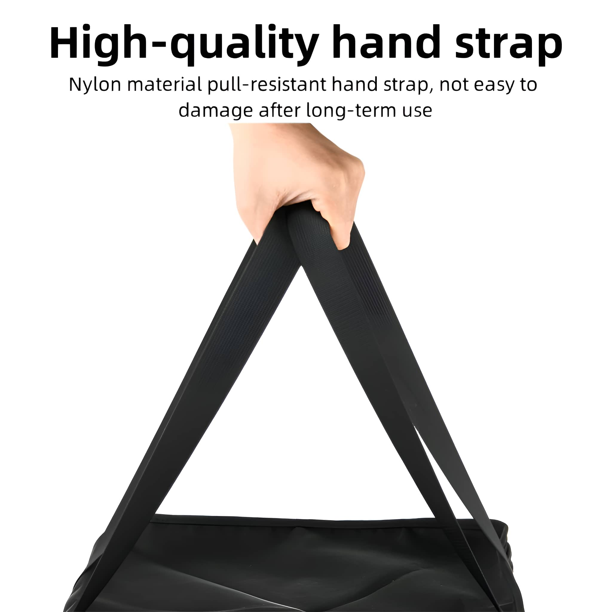 Eine Hand hält einen schwarzen Nylon-Handriemen. Weißer Hintergrund. Der Riemen ist schwarz.