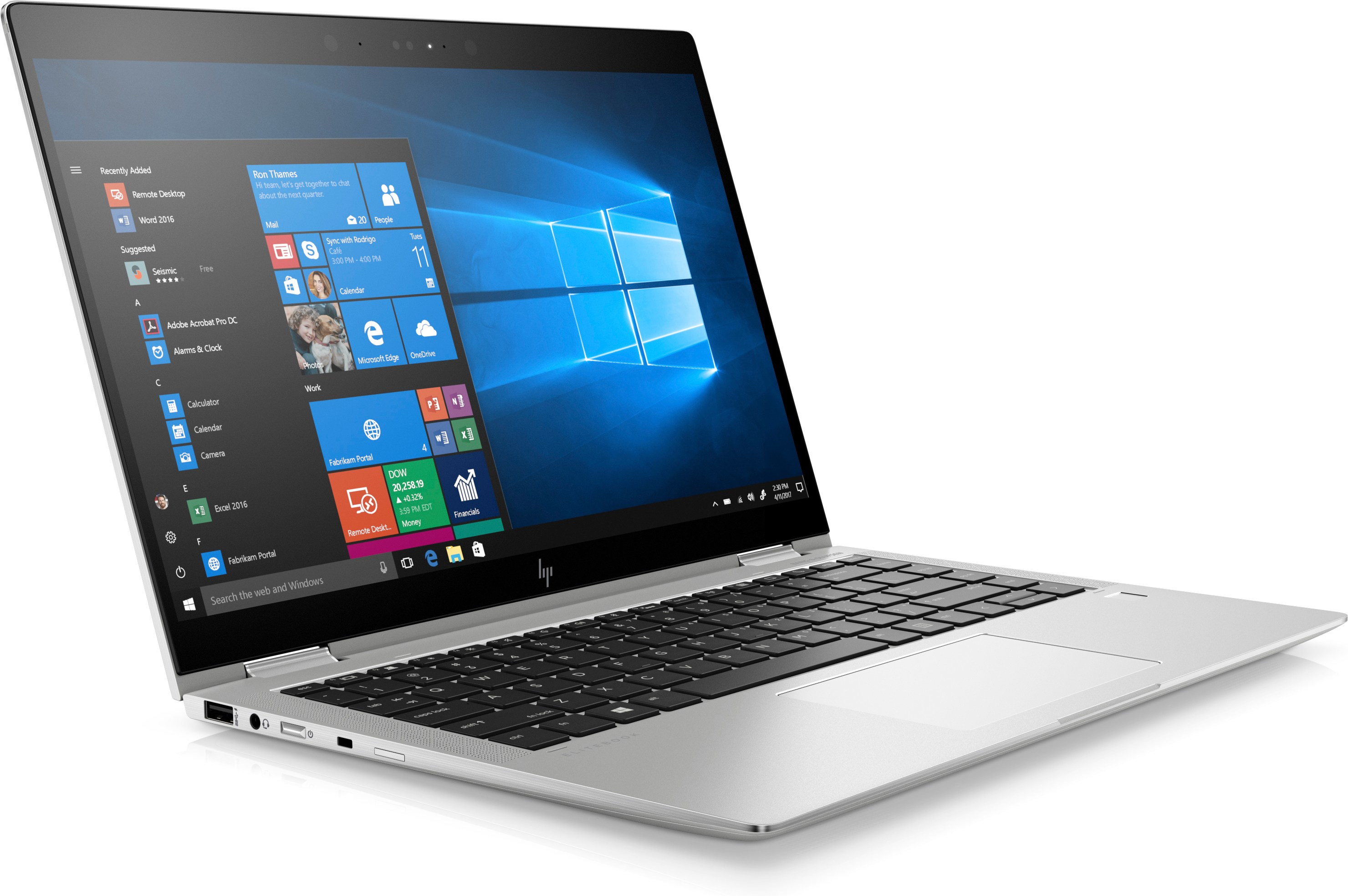 Silberner Laptop geöffnet, Windows-Bildschirm sichtbar. Tastatur und Touchpad stehen im Fokus, auf weißem Hintergrund.