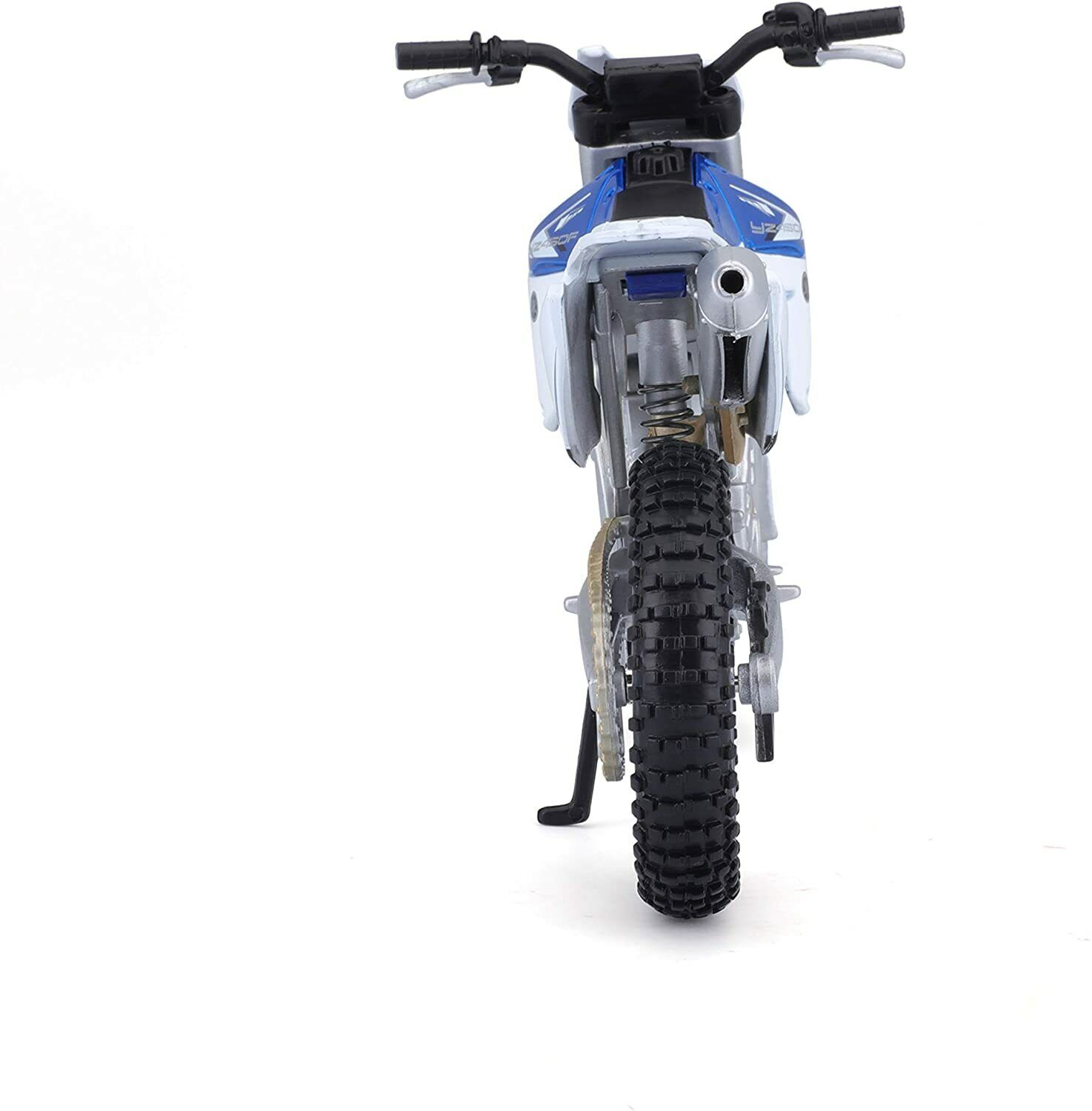 Spielzeugmotorrad von hinten gesehen, hauptsächlich weiß und blau, Hinterreifen prominent.