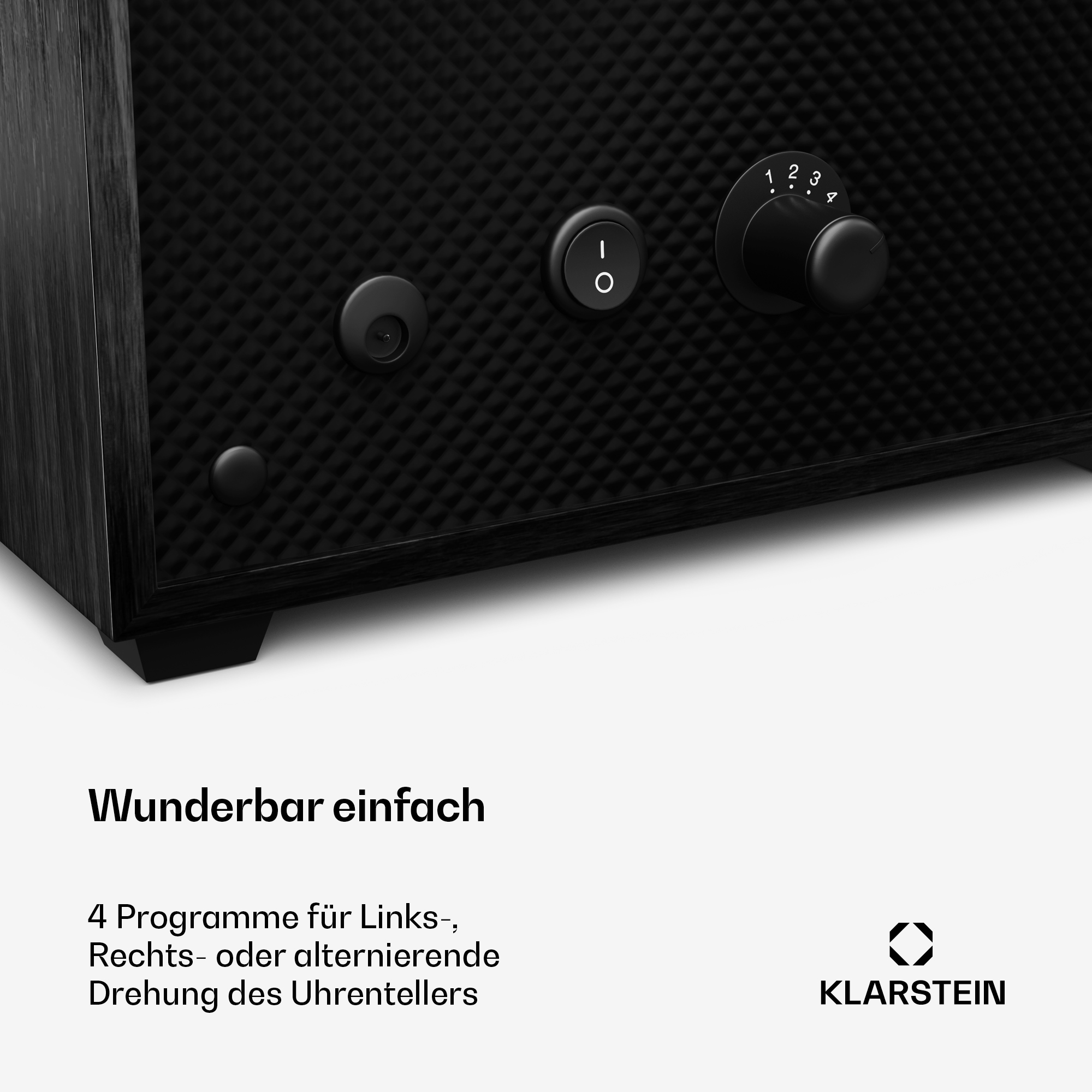 Schwarzer Uhrenbeweger aus Holz mit Knöpfen und einem Drehknopf für Einstellungen. Text: Wunderbar einfach.