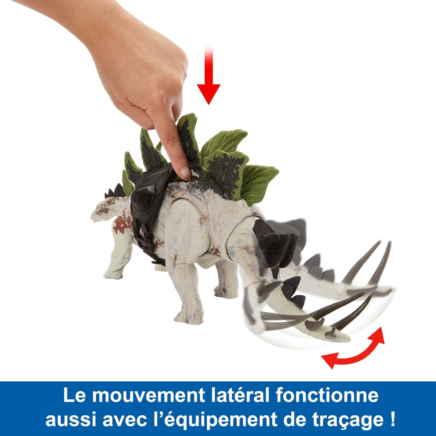 Un dito punta a un giocattolo di dinosauro. Il dinosauro è bianco e verde, con una sella nera.