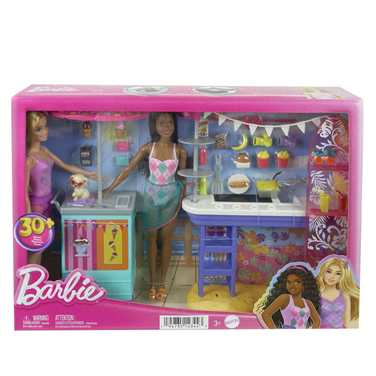 Barbie-Spielset in einer rosa Box. Zwei Puppen, ein Welpe und ein Strand-Food-Stand sind sichtbar.