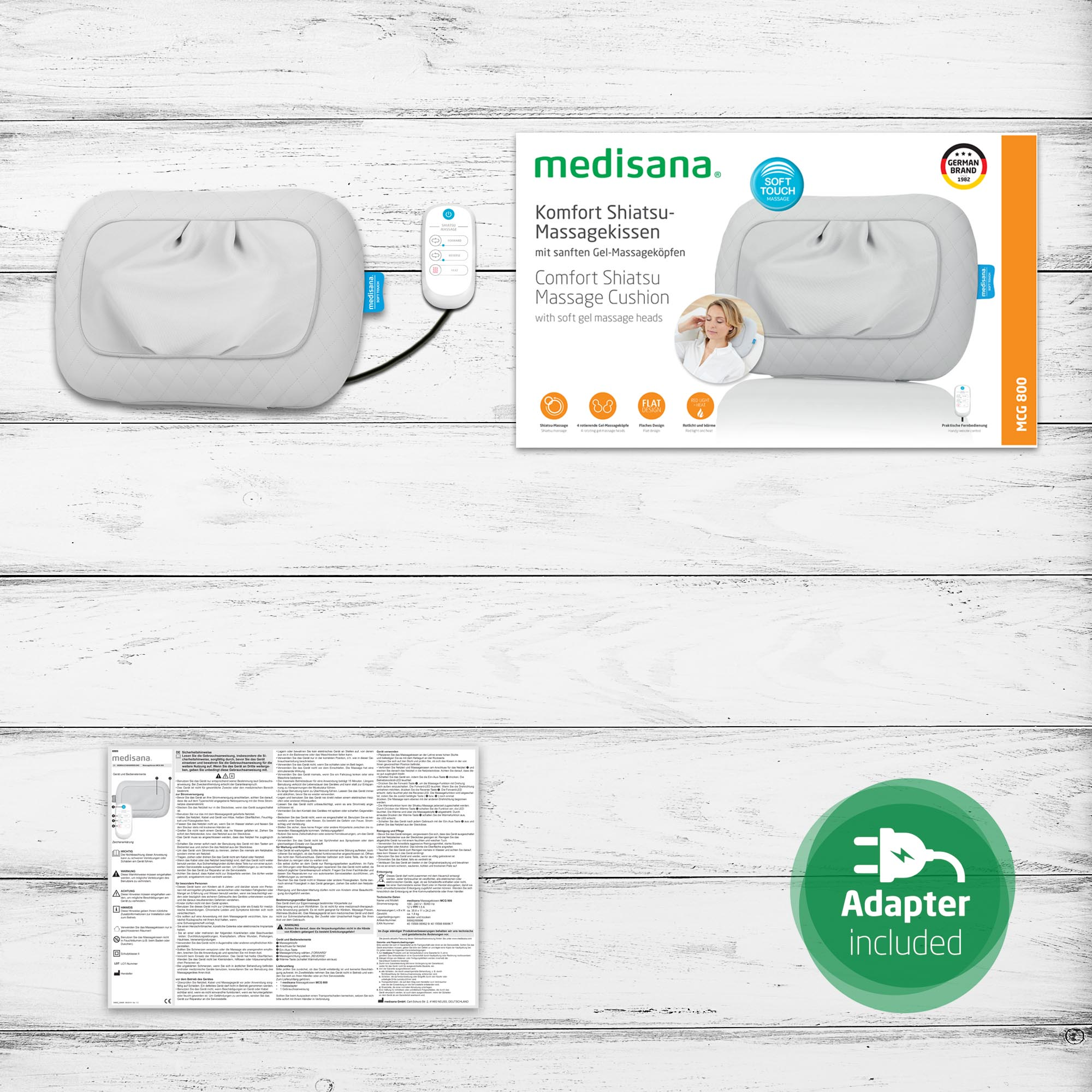Cojín de masaje blanco con mando, caja y adaptador incluido.