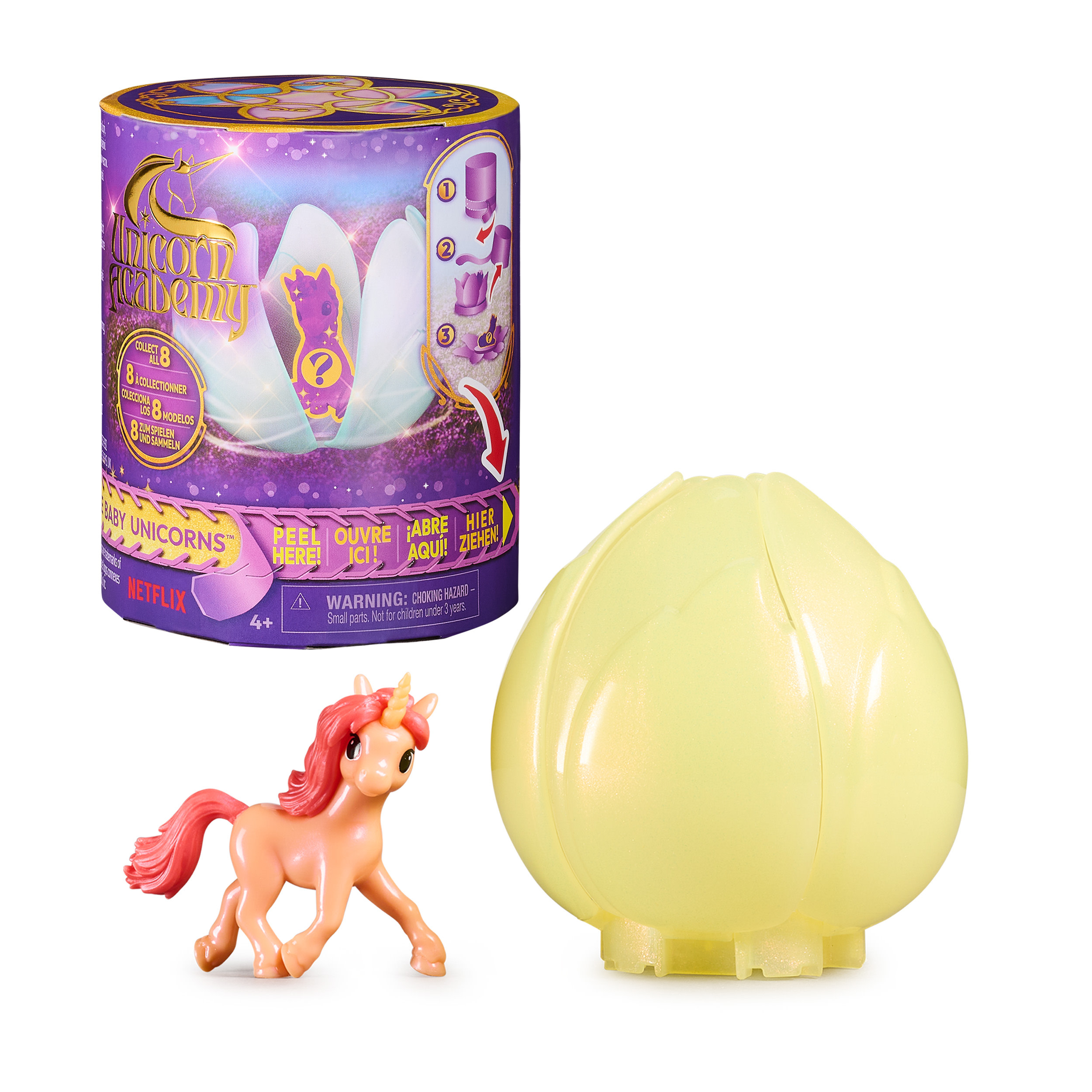 Unicorno giocattolo e contenitore a forma di uovo. Il contenitore è giallo, l'unicorno rosa, sfondo bianco.