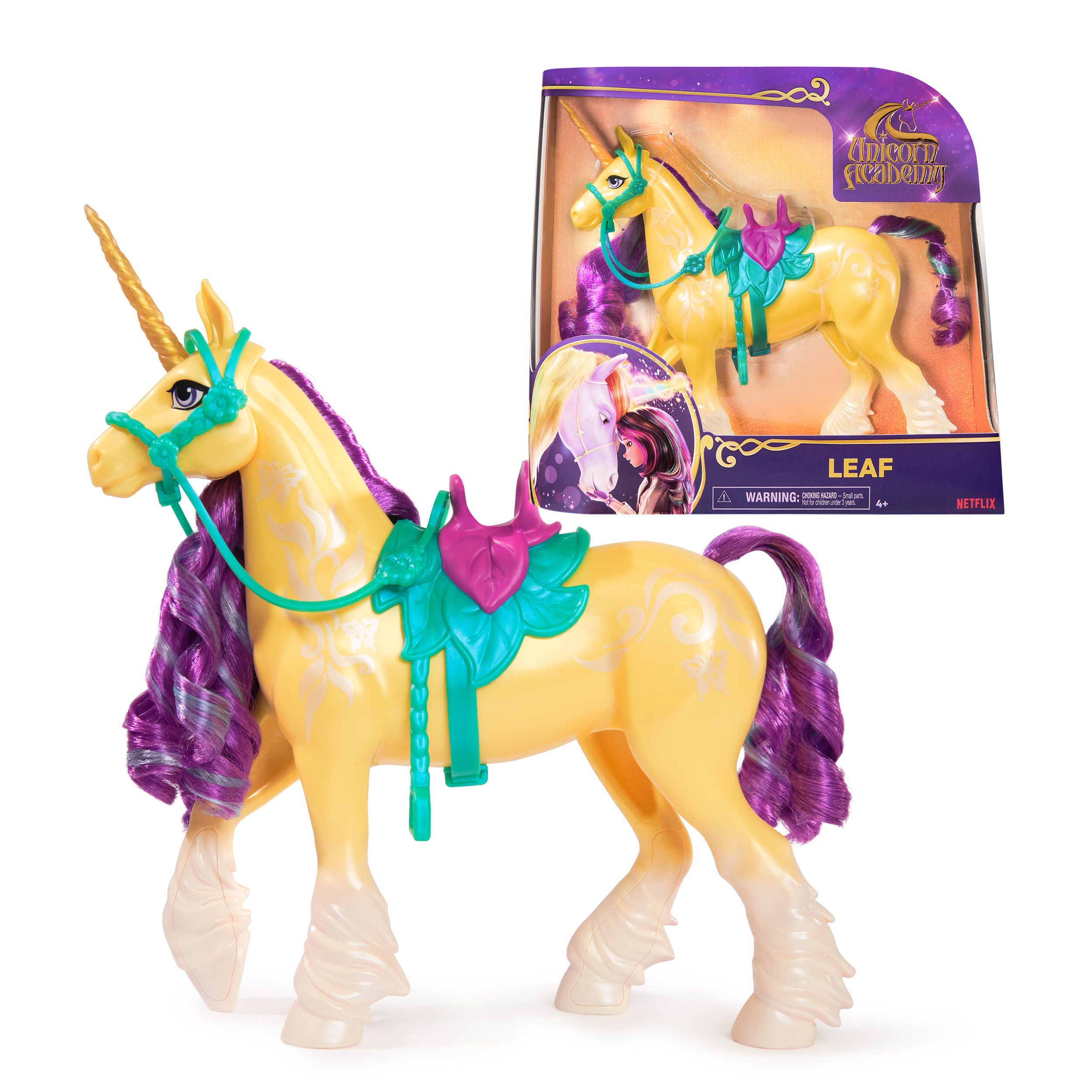 Un unicorno giocattolo giallo con criniera e coda viola, in una scatola.