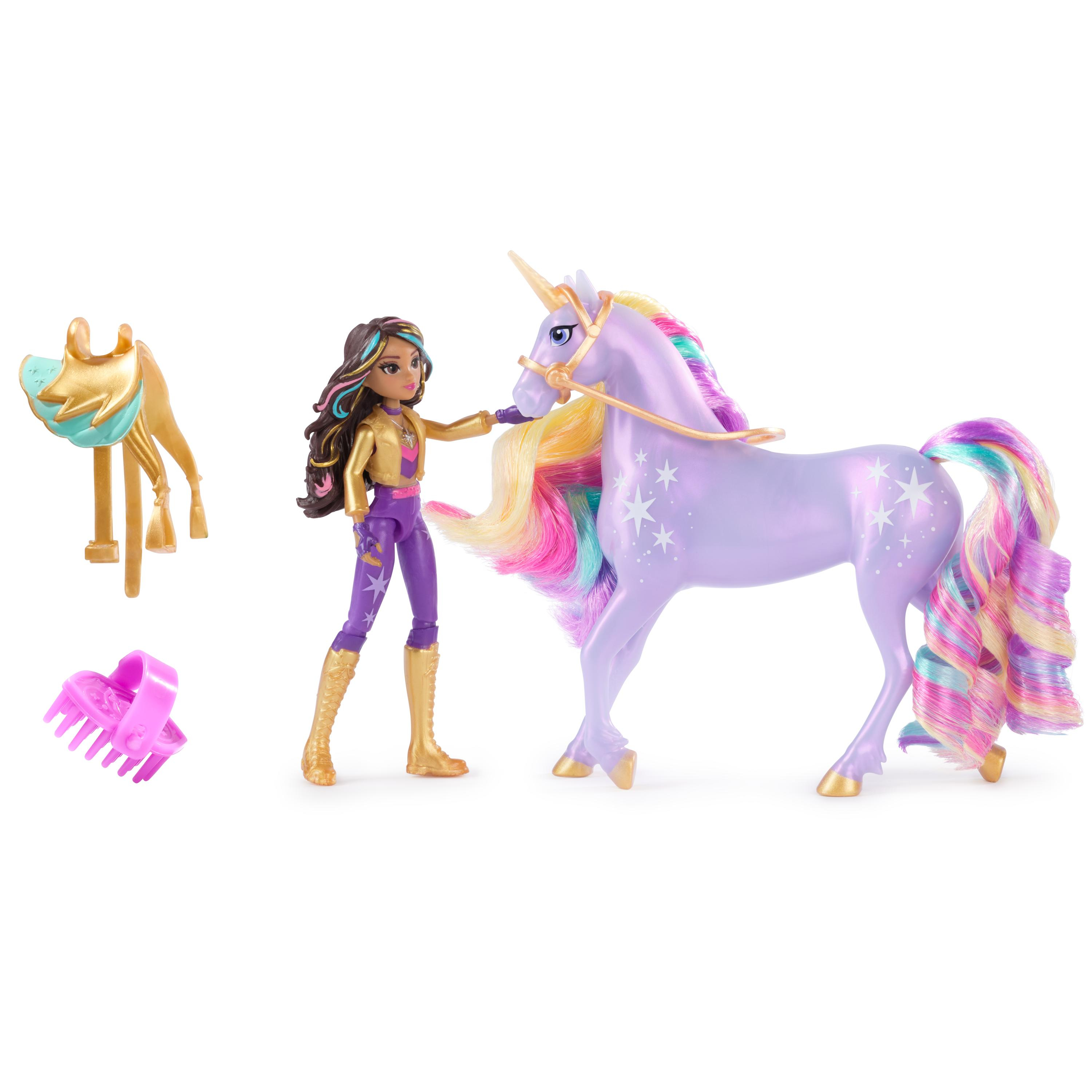 Juego de juguetes con un unicornio morado, una muñeca y accesorios. El juego está sobre una superficie blanca.
