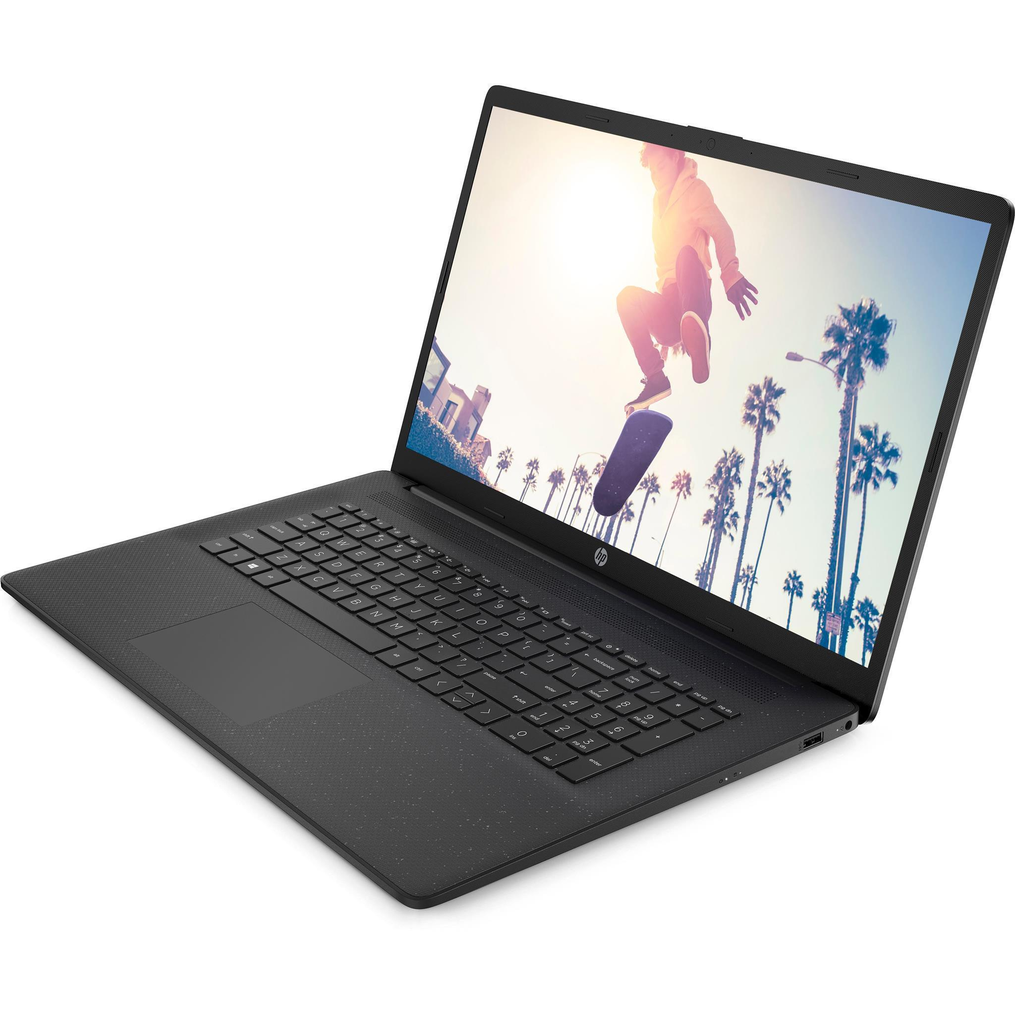 Ein Laptop auf einer weißen Oberfläche mit einer Person, die auf dem Bildschirm skateboardet.