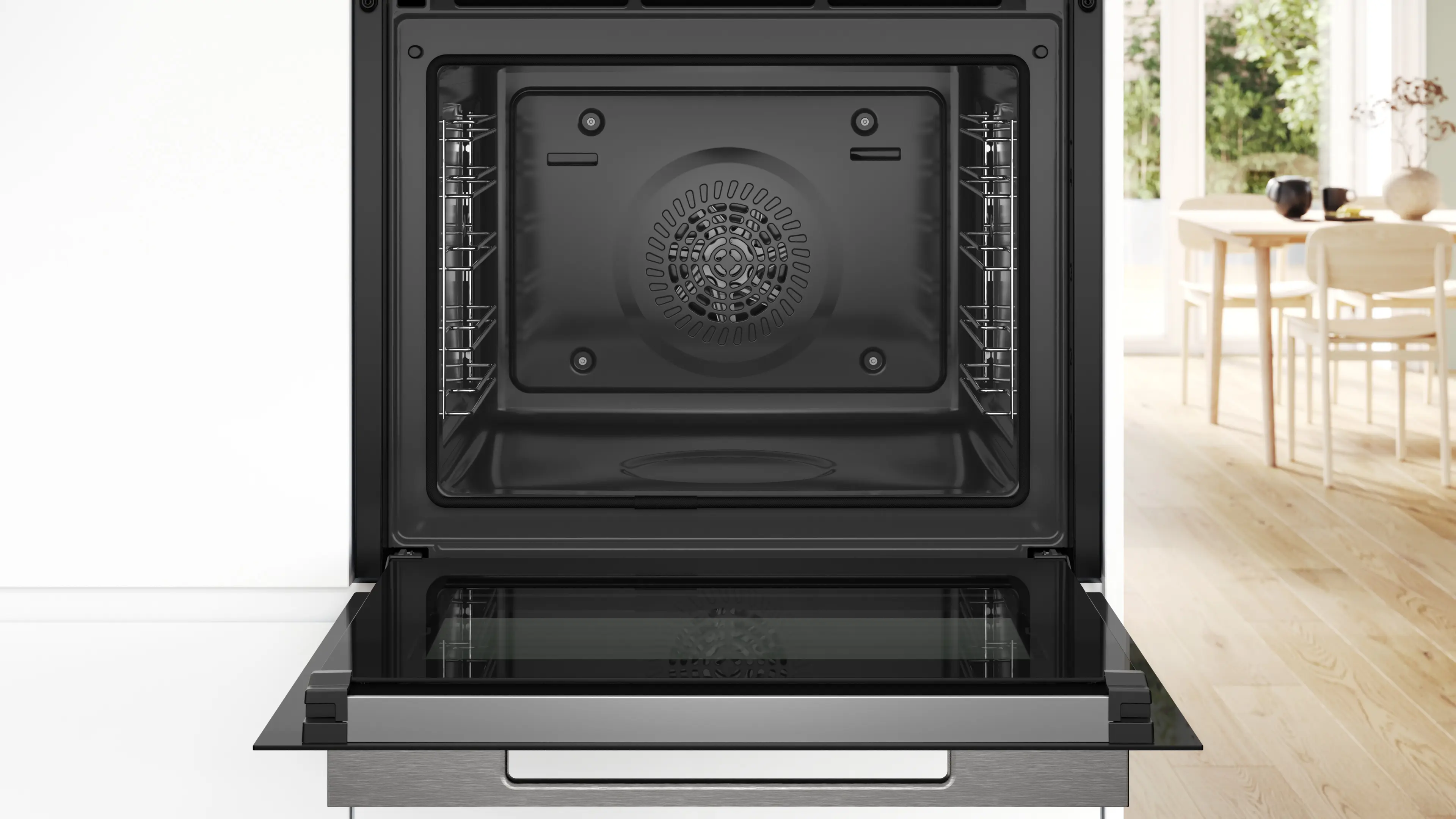 An open oven interior. The oven is black and has two racks. The oven door is open, showing the interior.