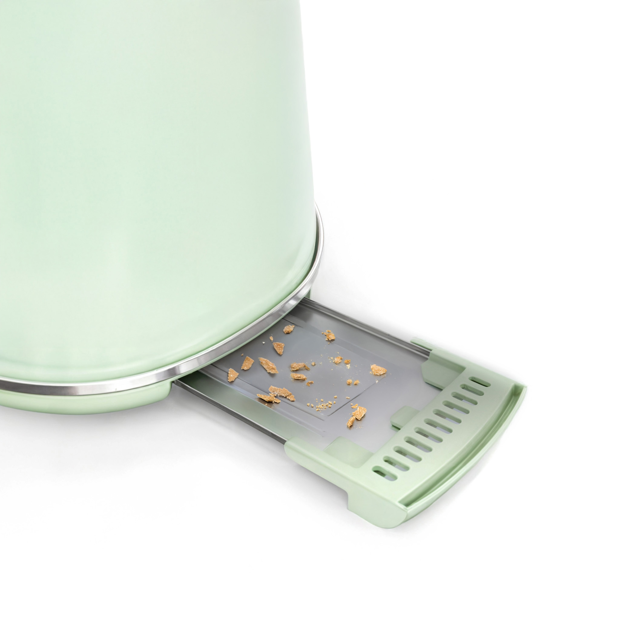 Mintgrüner Toaster mit herausgezogener Krümelschublade. Krümel sind in der Schublade sichtbar.