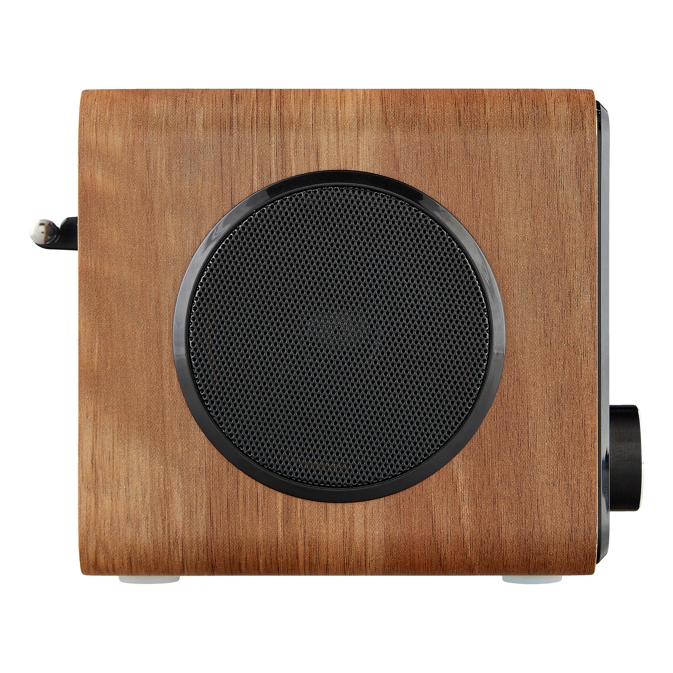 Drewniany głośnik z okrągłą maskownicą i pokrętłem głośności.