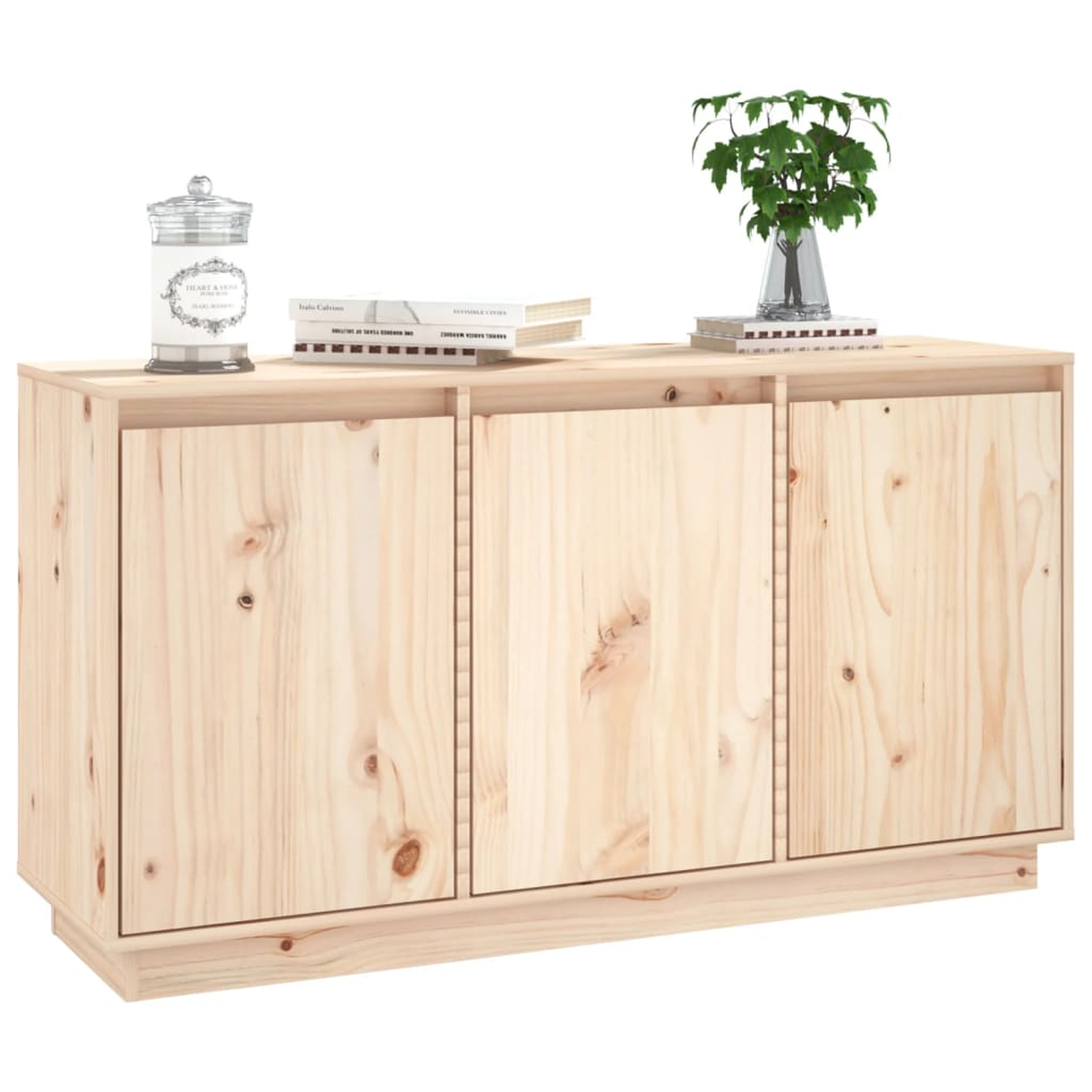 Holzschrank mit drei Türen. Oben: Kerze im Glas, Bücher, Pflanze in Glasvase.