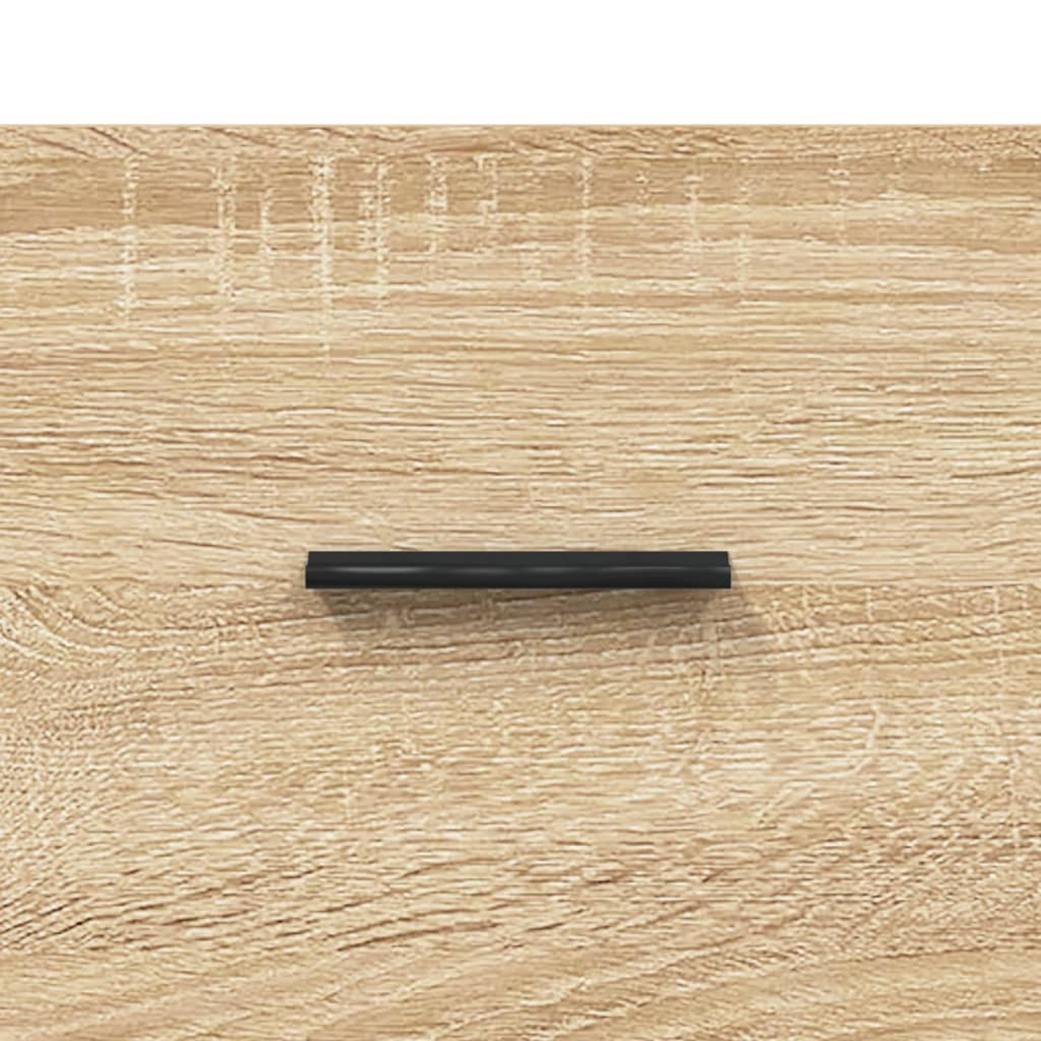 Nahaufnahme eines hölzernen Schubladengriffs, schwarz, auf Holzoberfläche.