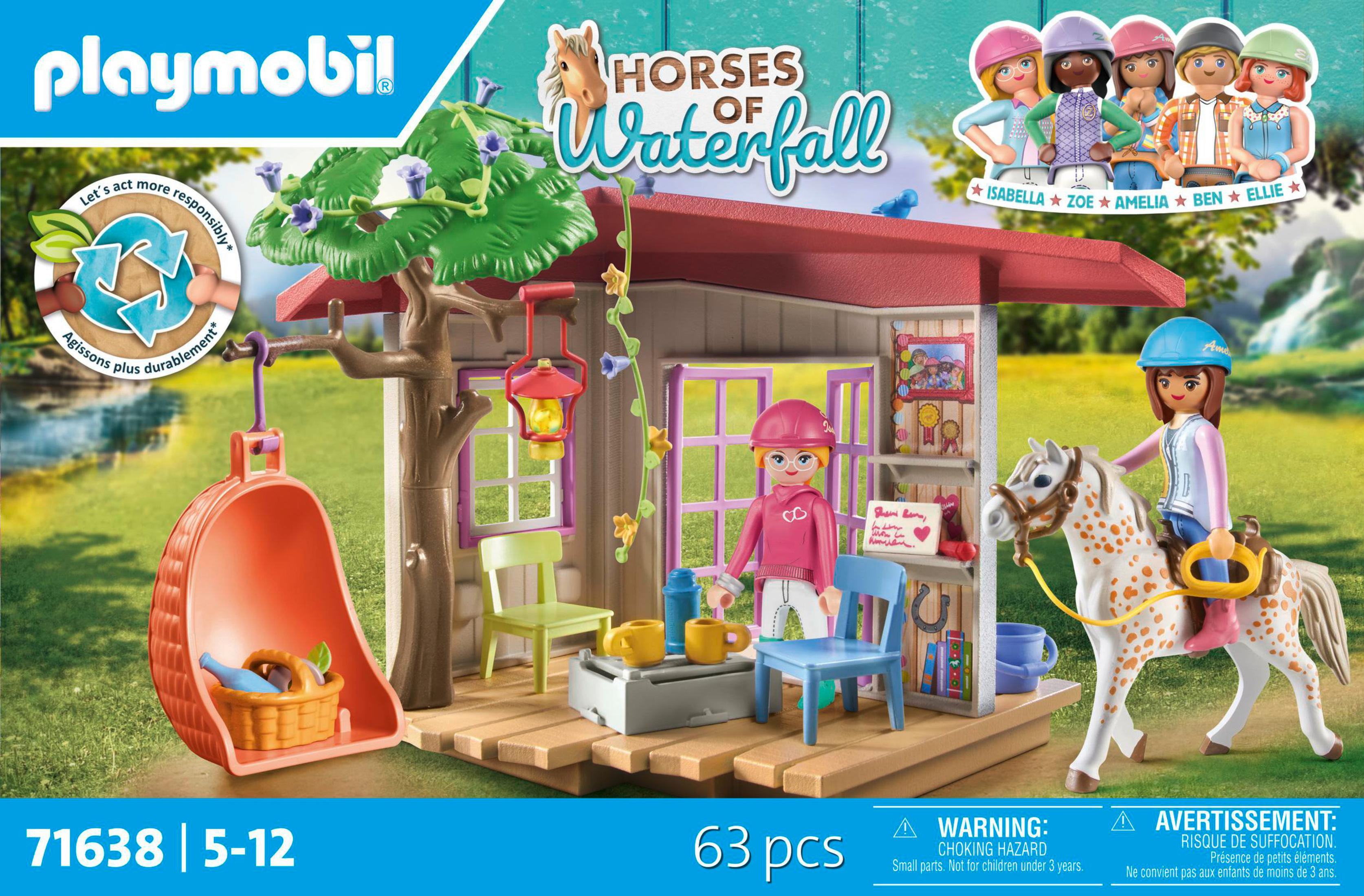 Set scatola Playmobil con una stalla e figure di ragazze e cavalli. Testo: Horses of Waterfall.