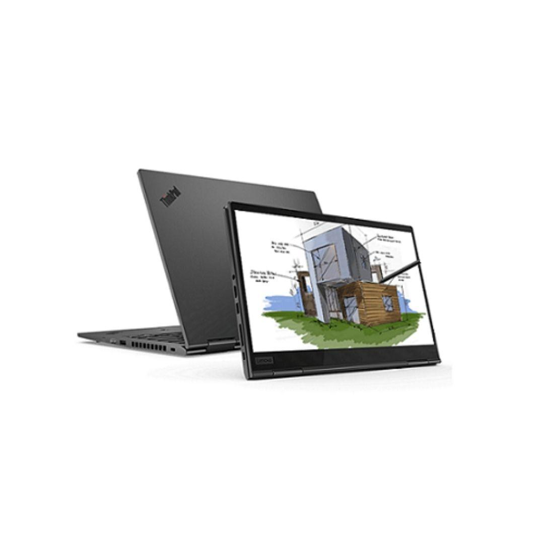 Laptop mit offenem Bildschirm, der ein Hausdesign zeigt. Ein weiterer geschlossener Laptop dahinter.