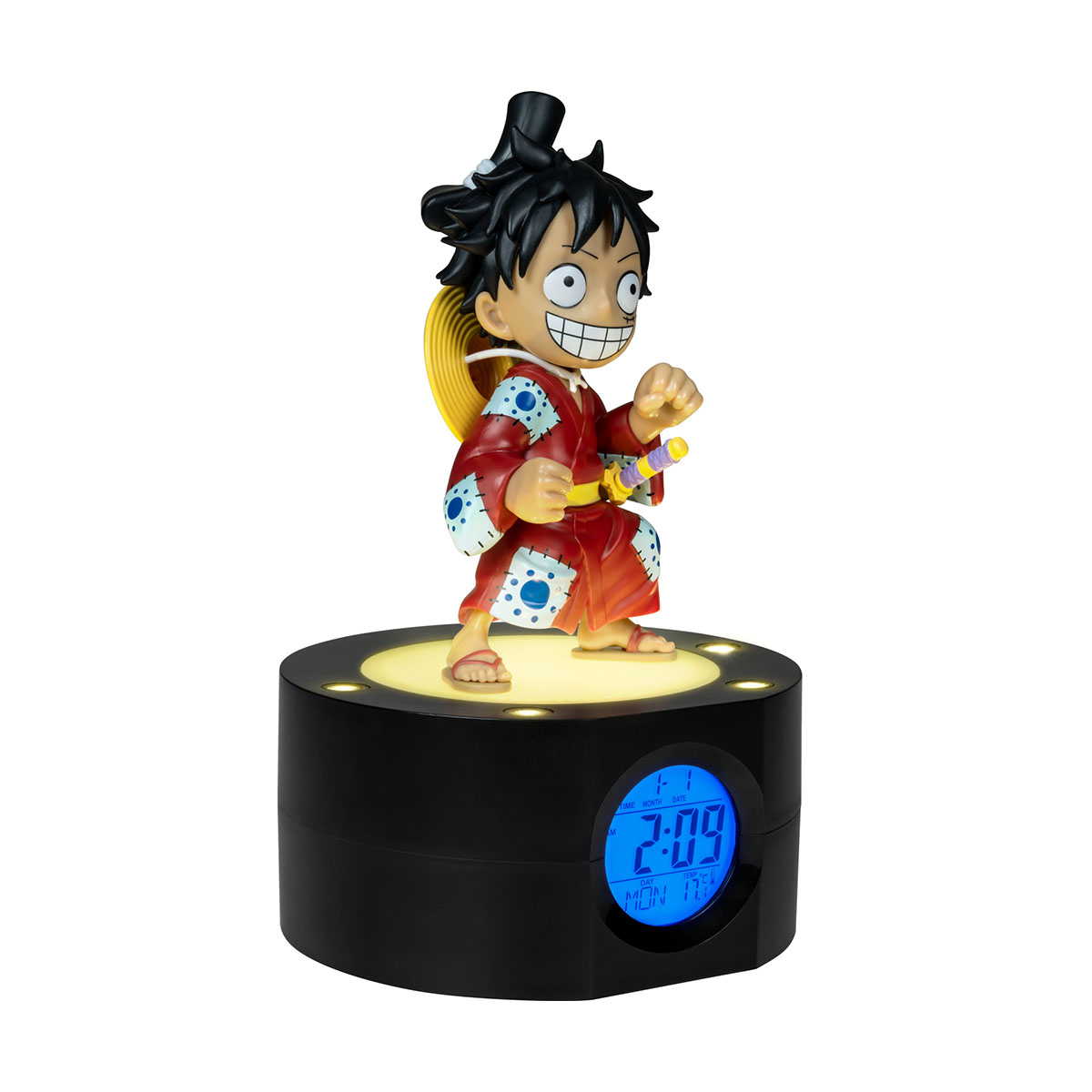 Luffy-Figur auf schwarzer Uhrenbasis, von unten beleuchtet. Er trägt ein rotes Outfit, lächelt.