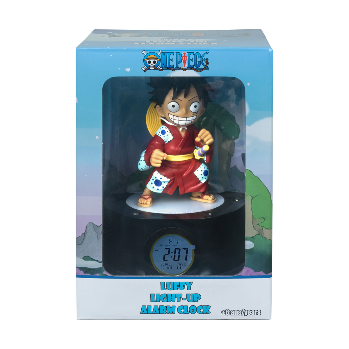 Ein One Piece Luffy Wecker in seiner Box mit digitaler Anzeige, vor weißem Hintergrund.