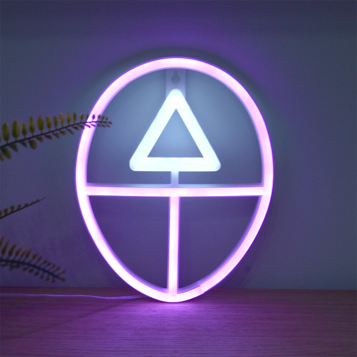 Neonschild mit einem Kreis, einem Dreieck darin und einer horizontalen und vertikalen Linie in der Mitte.