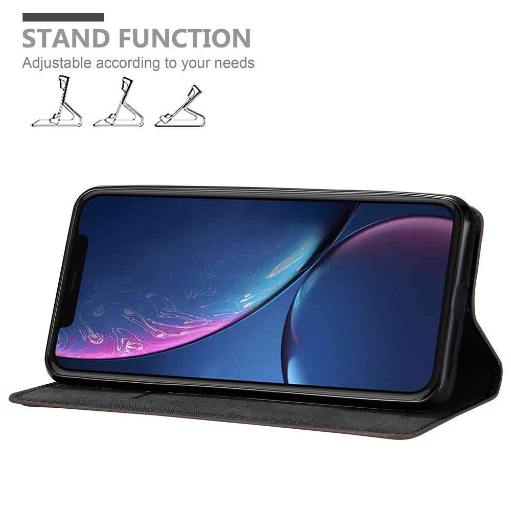Schwarzes Telefon in einem schwarzen Gehäuse, zum Aufstellen aufgestellt. Text sagt: "STAND FUNCTION".