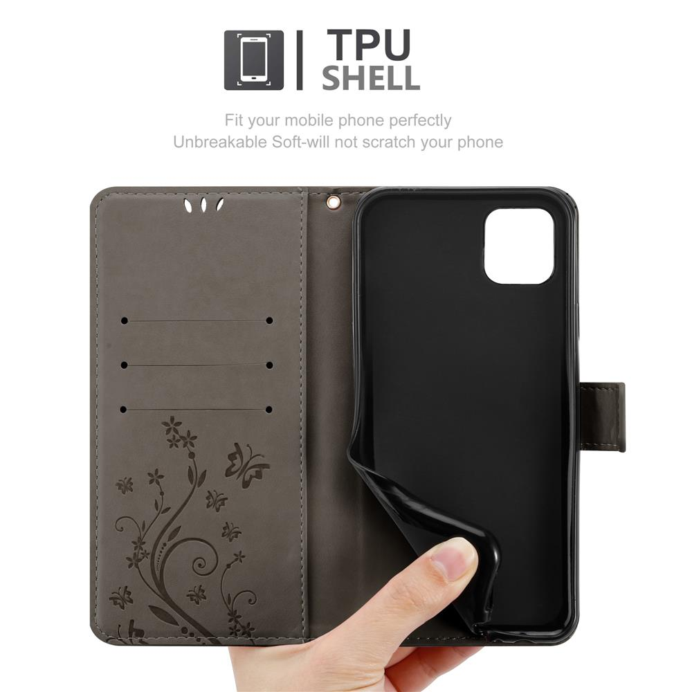 Una custodia grigia per telefono con un design floreale e una mano.