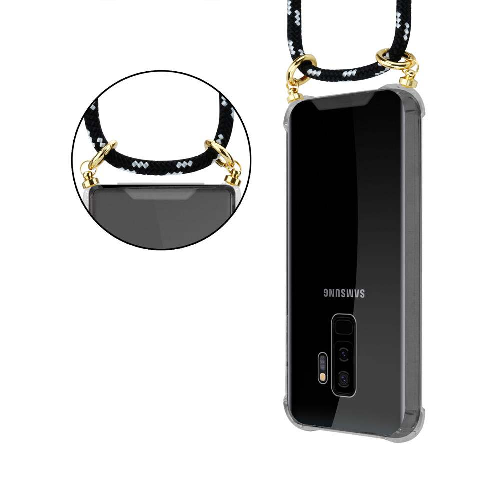 Un telefono nero con un cinturino bianco e nero. Il telefono ha una fotocamera.
