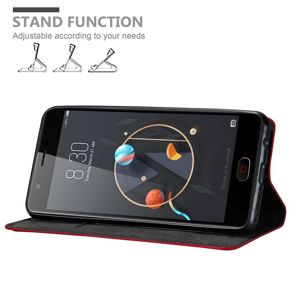 Telefon mit Standfunktion, zeigt den Bildschirm mit bunten Planeten und rotem Gehäuse.