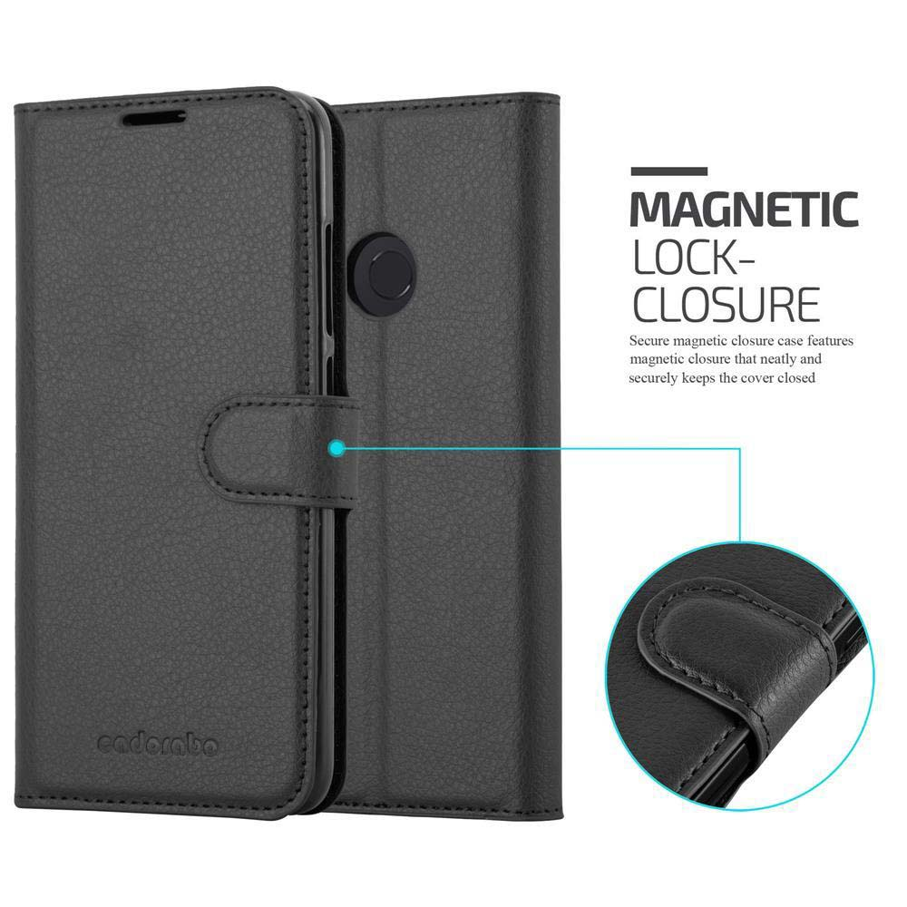 Una funda de teléfono negra está abierta. Tiene un cierre magnético. La funda es negra con un detalle circular en la parte posterior.