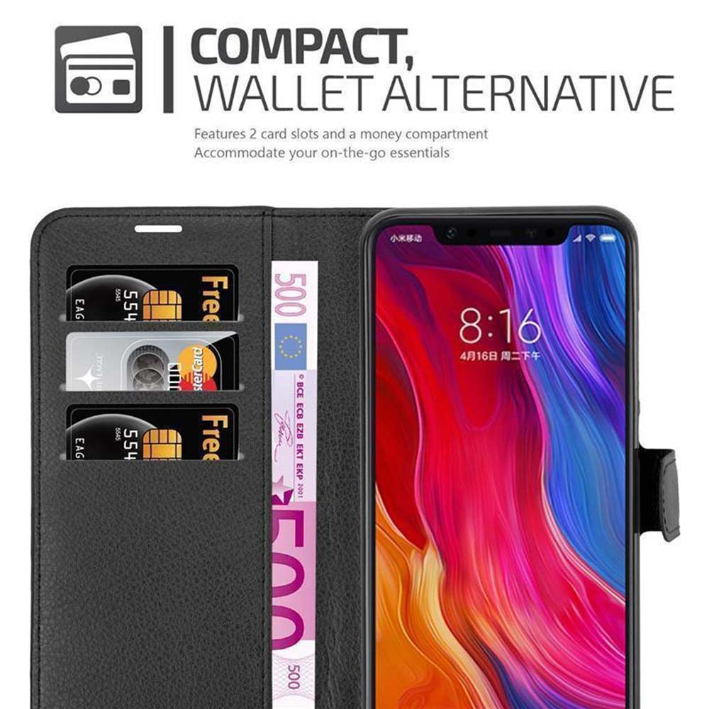 Funda negra tipo cartera para teléfono con ranuras para tarjetas, dinero y un teléfono con pantalla colorida.