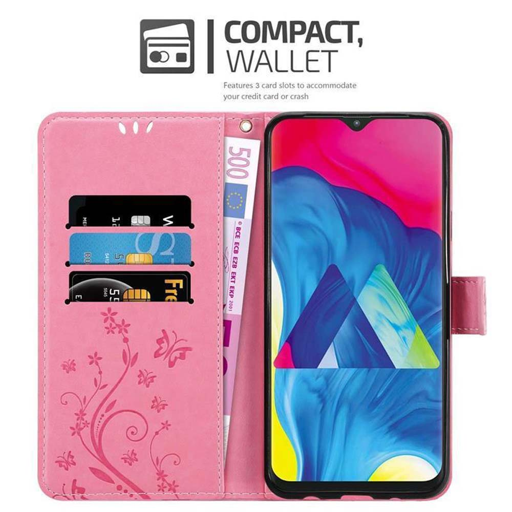 Custodia per telefono rosa aperta, con telefono, carte e denaro all'interno. Design floreale. Testo: “Compatto, Portafoglio”.
